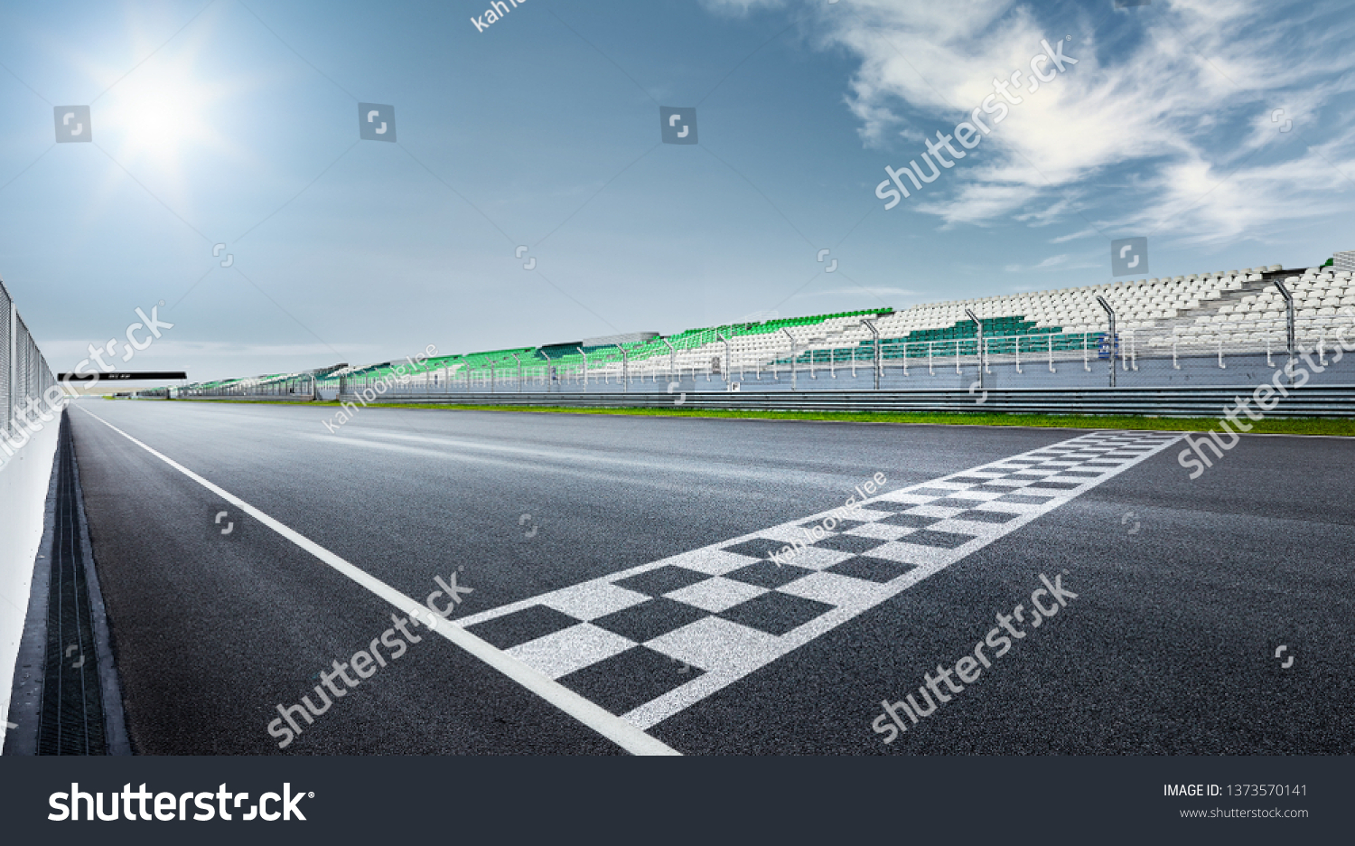 Black and white finish line with dramatic view of a modern race track. #1373570141