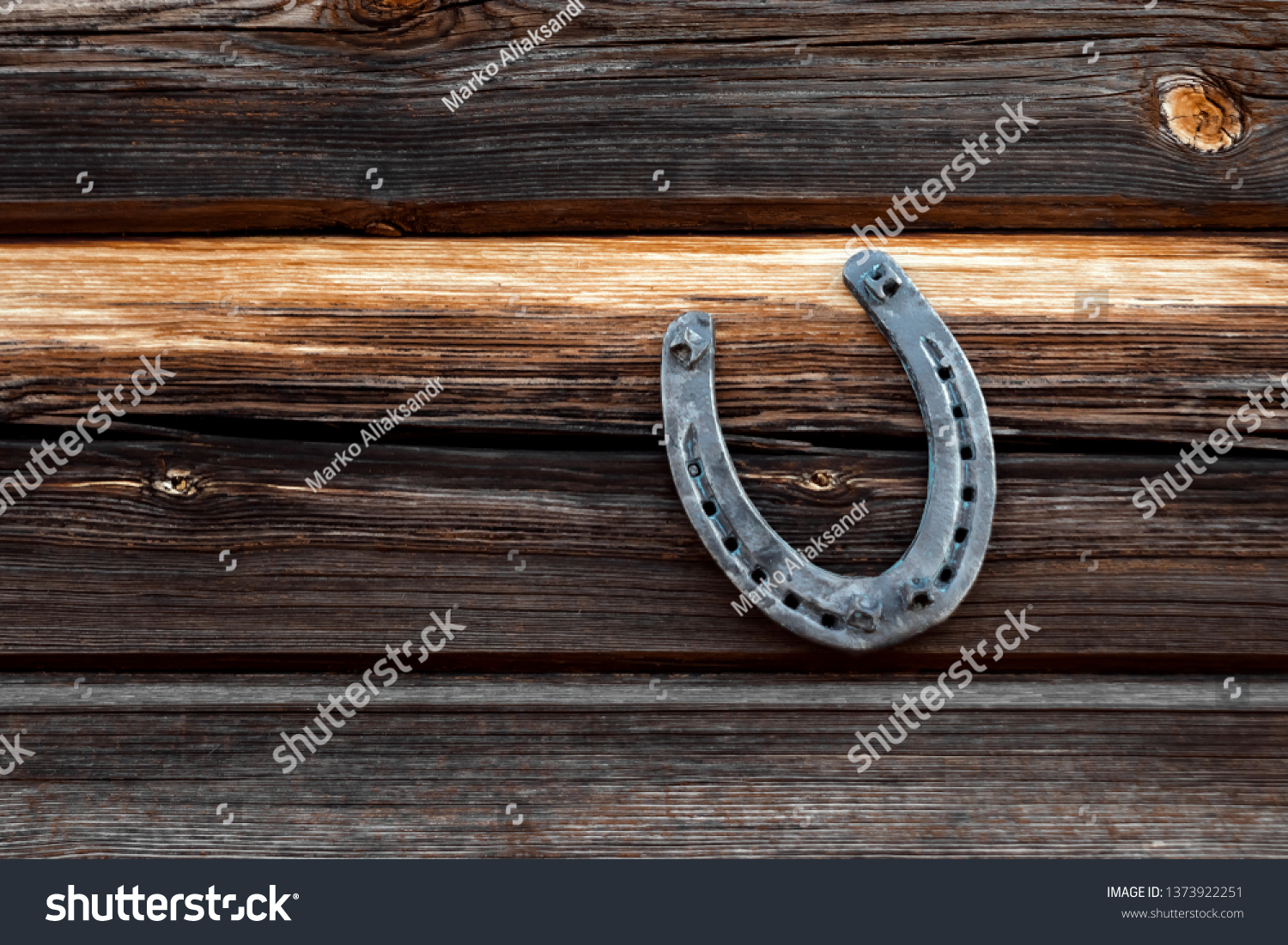 Old horseshoe on an old wooden board. The concept of luck, luck, luck. #1373922251