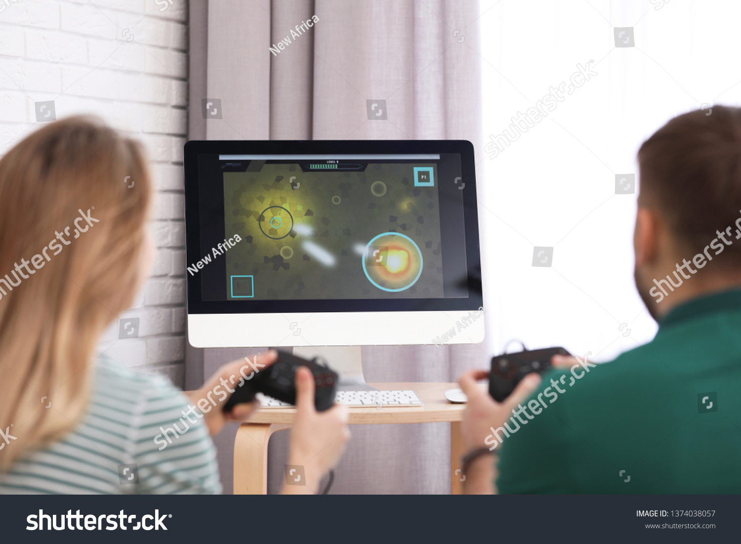 Young couple playing video game at home #1374038057