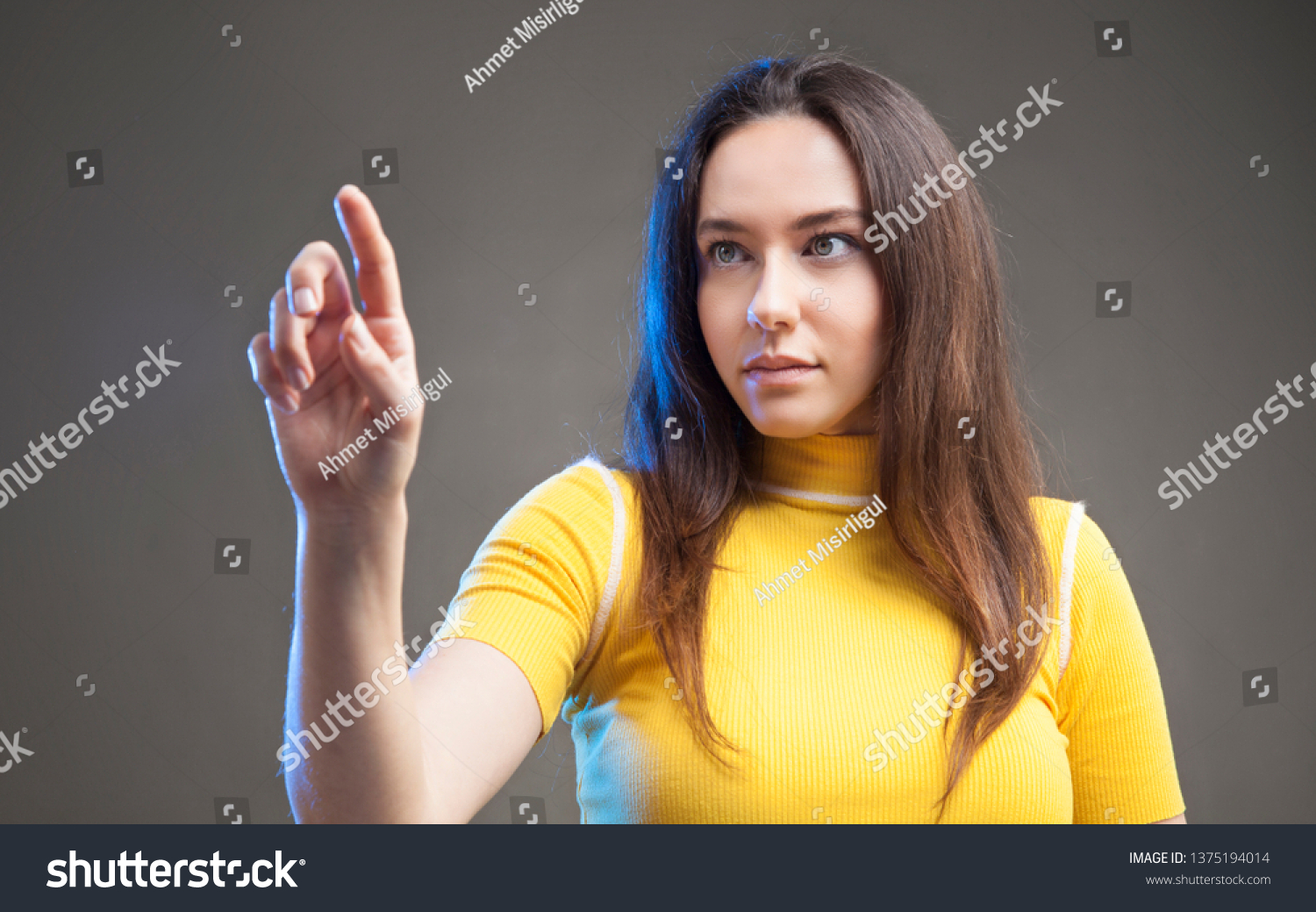 Young woman touching the empty screen #1375194014