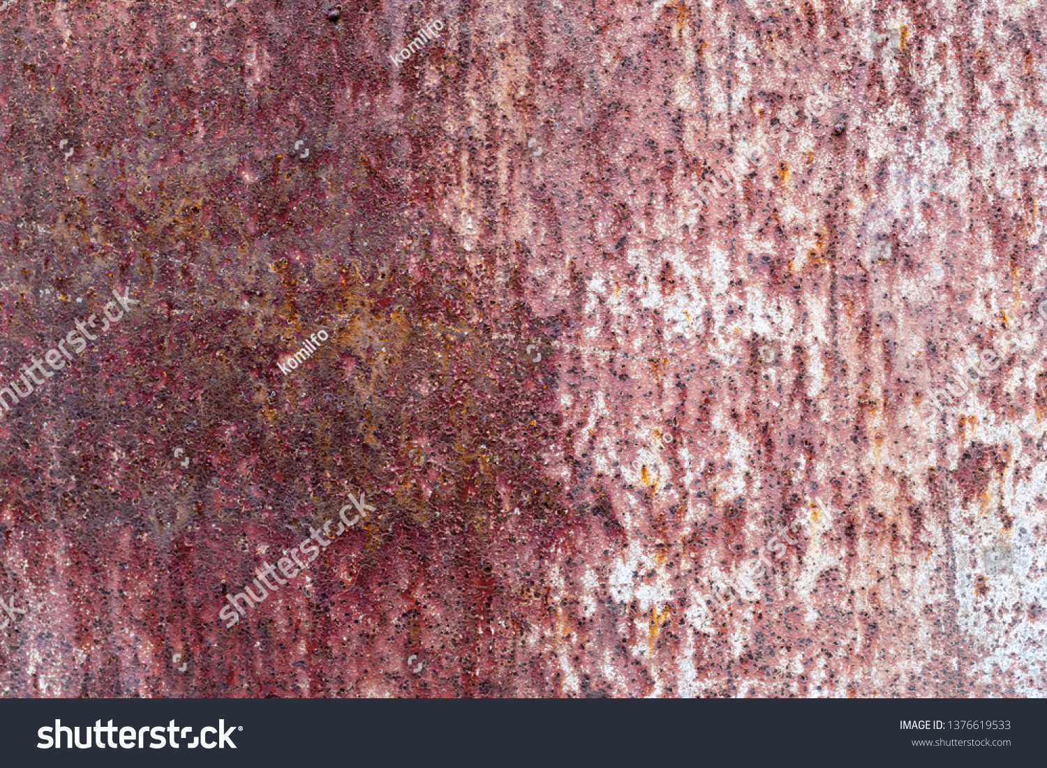 The old rusty surface of metal damaged by bad weather. Spots and smudges of paint. Ready photo background. Macro. #1376619533