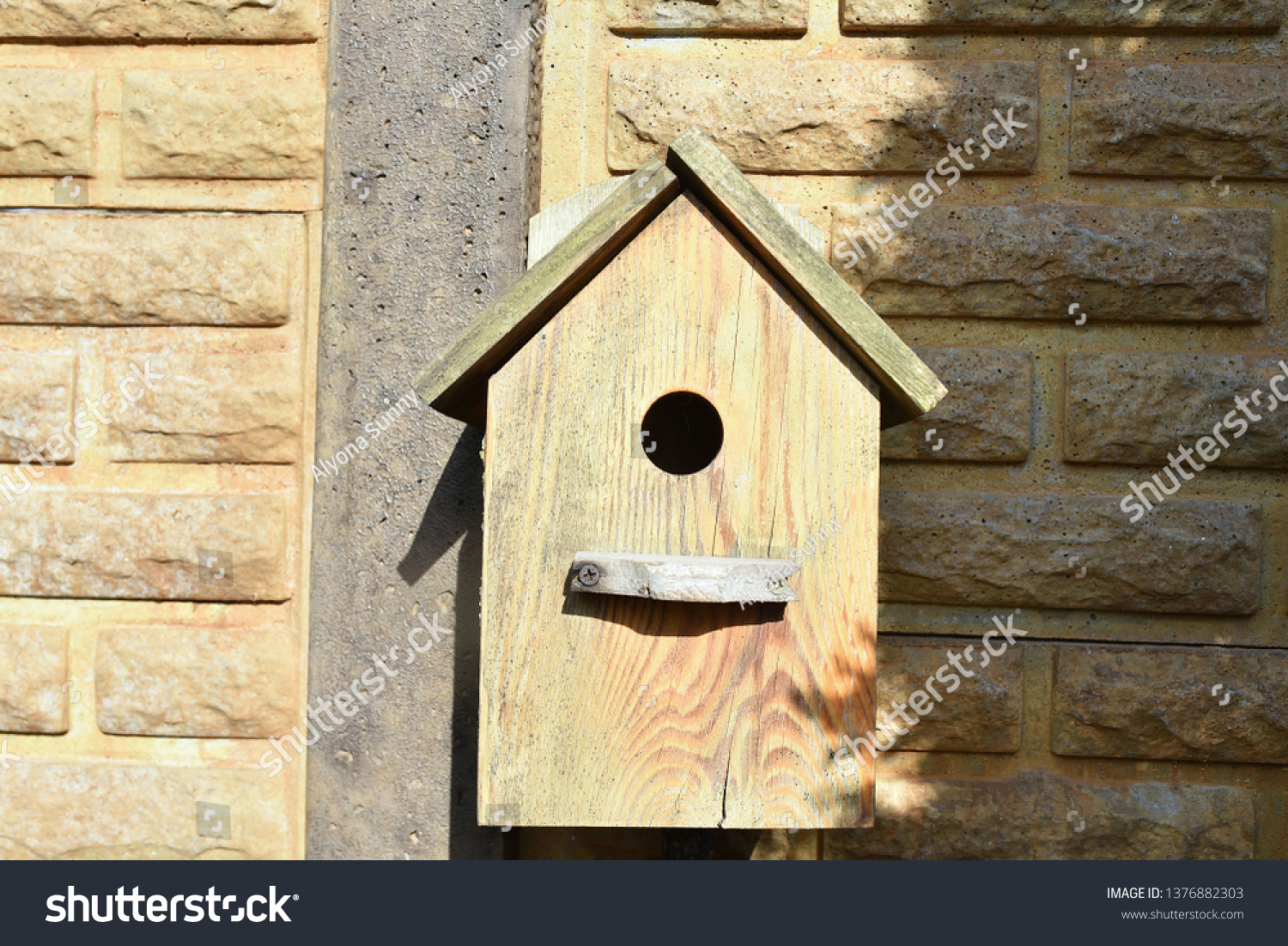 Closeup of a weathered birdhouse. wooden nesting box. #1376882303