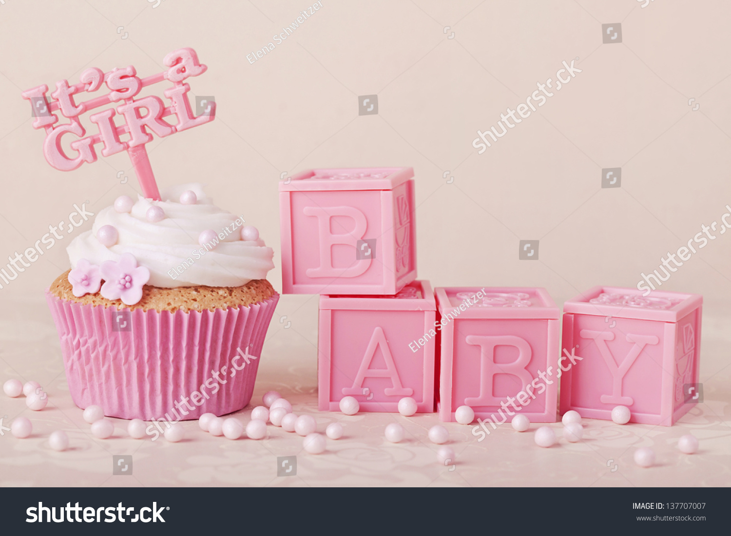 Cupcake with a cake pick and baby cubes #137707007