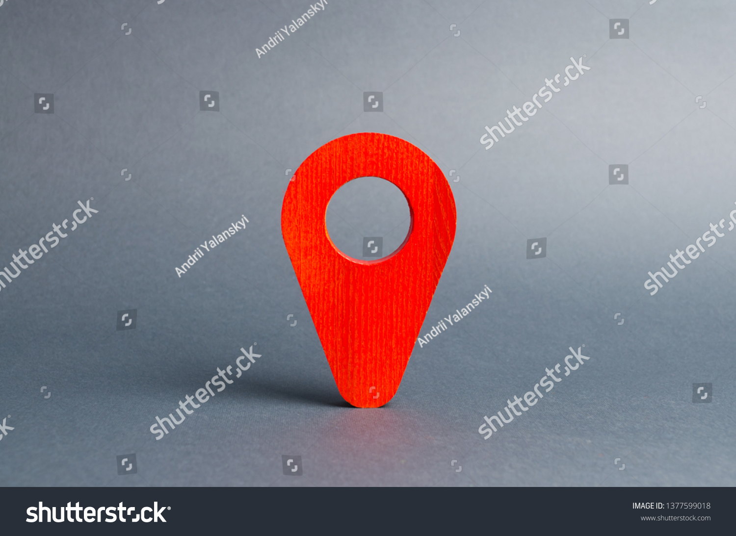 Red pointer location on a gray background. Concept of navigation and venue. Tourism and travel. Spying on the citizens.. Orientation around the city, the location of events and events. #1377599018