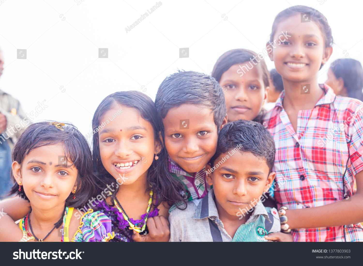 VARKALA, KERALA, INDIA - DECEMBER 15, 2012: Portrait smiling indian children on Varkala during puja ceremony on holy place - on the Papanasam beach #1377803903