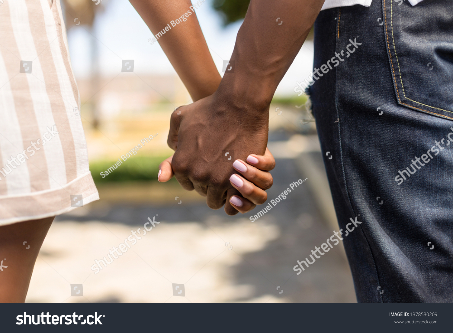 Close up outdoor protrait of black african american couple holding hands #1378530209