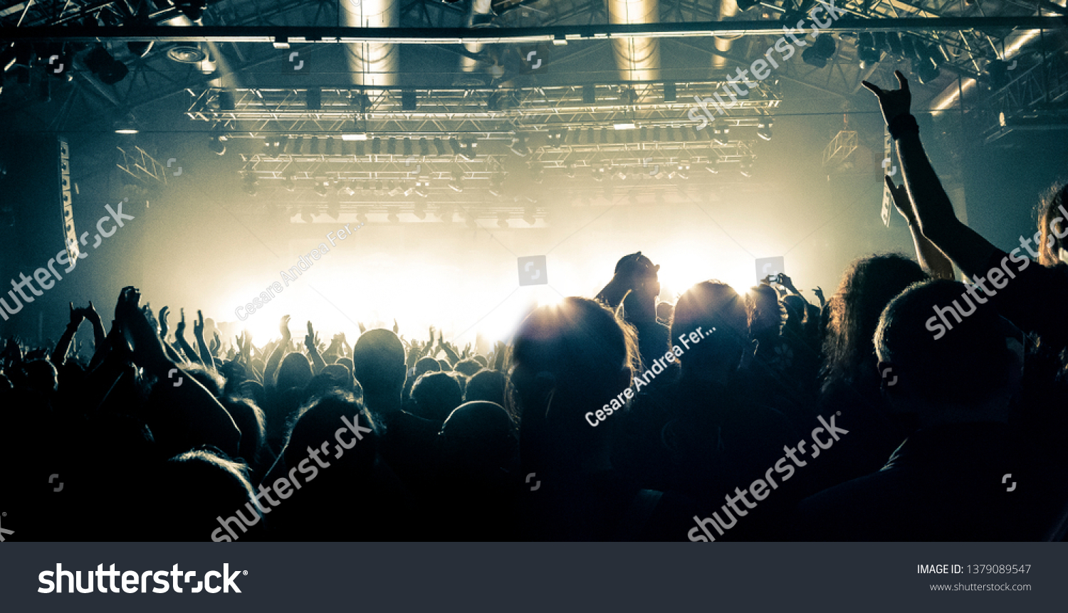 Party night in a concert hall, people silhouettes are visible #1379089547