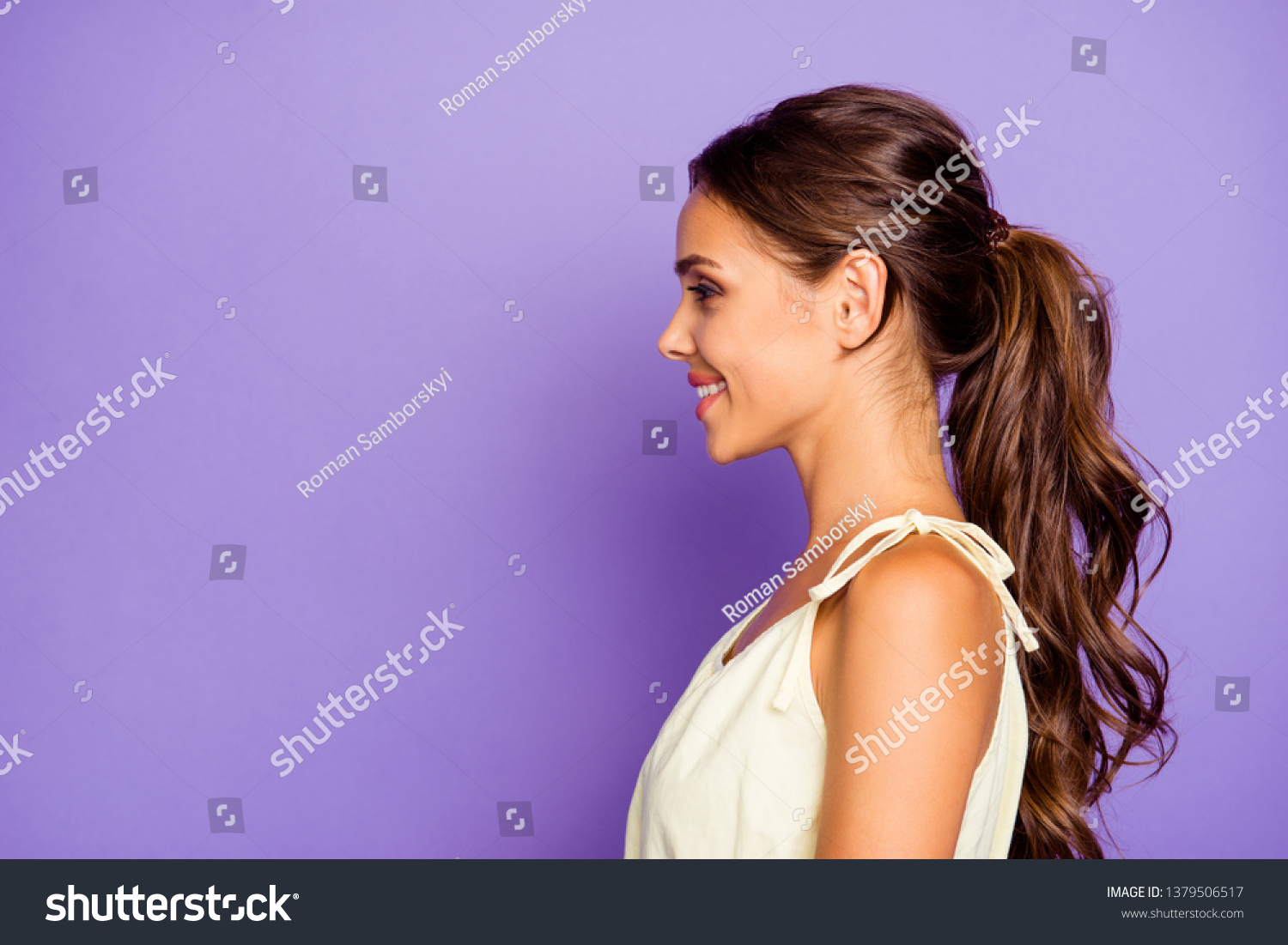 Close-up profile side view portrait of nice adorable well-groomed attractive stunning lovable fascinating magnificent winsome content cheerful cheery wavy-haired girl isolated over violet background #1379506517