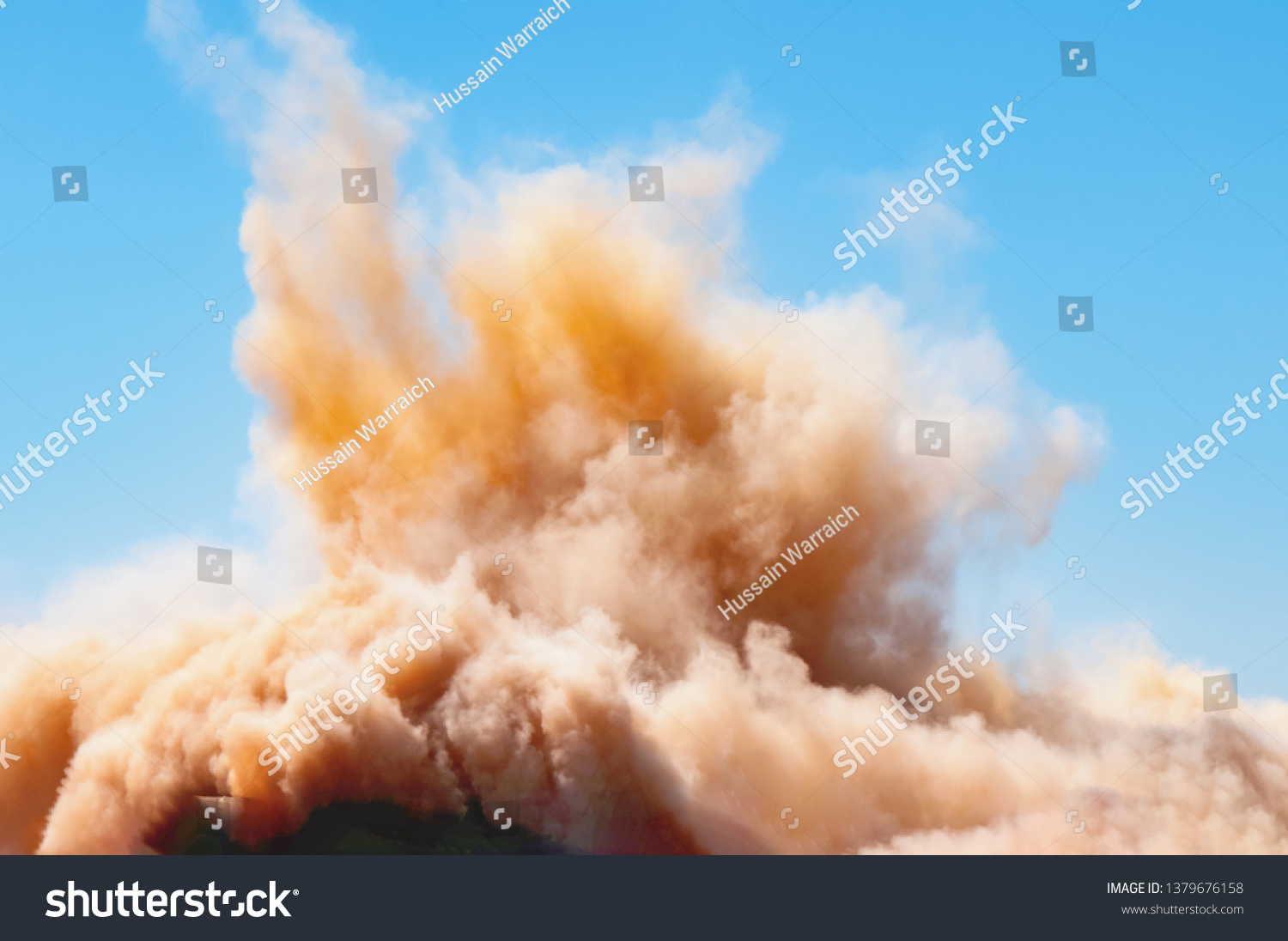Rock dust clouds after the blast on the mining site  #1379676158