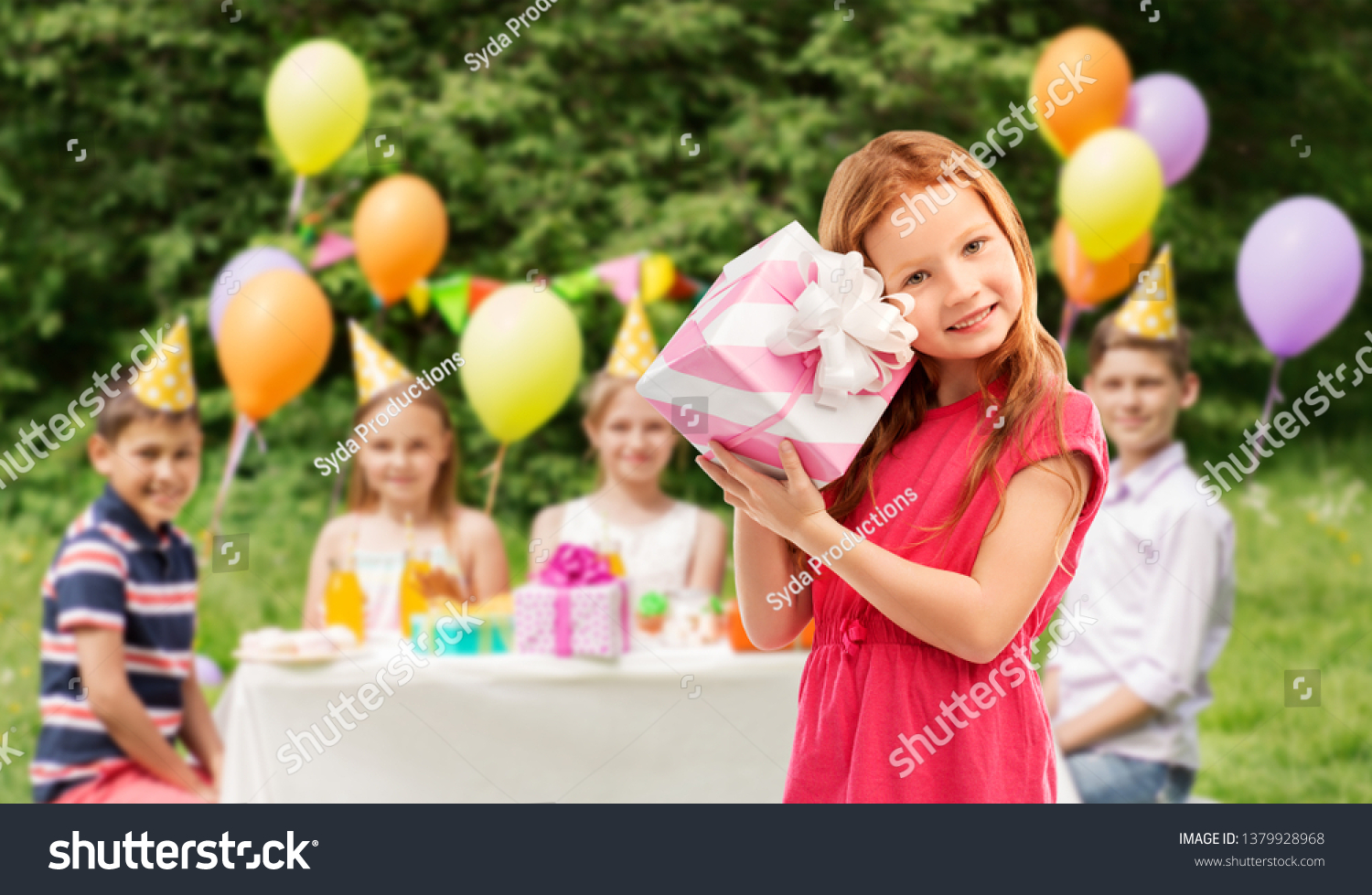 birthday and people concept - lovely red haired girl with gift box over party at summer park #1379928968