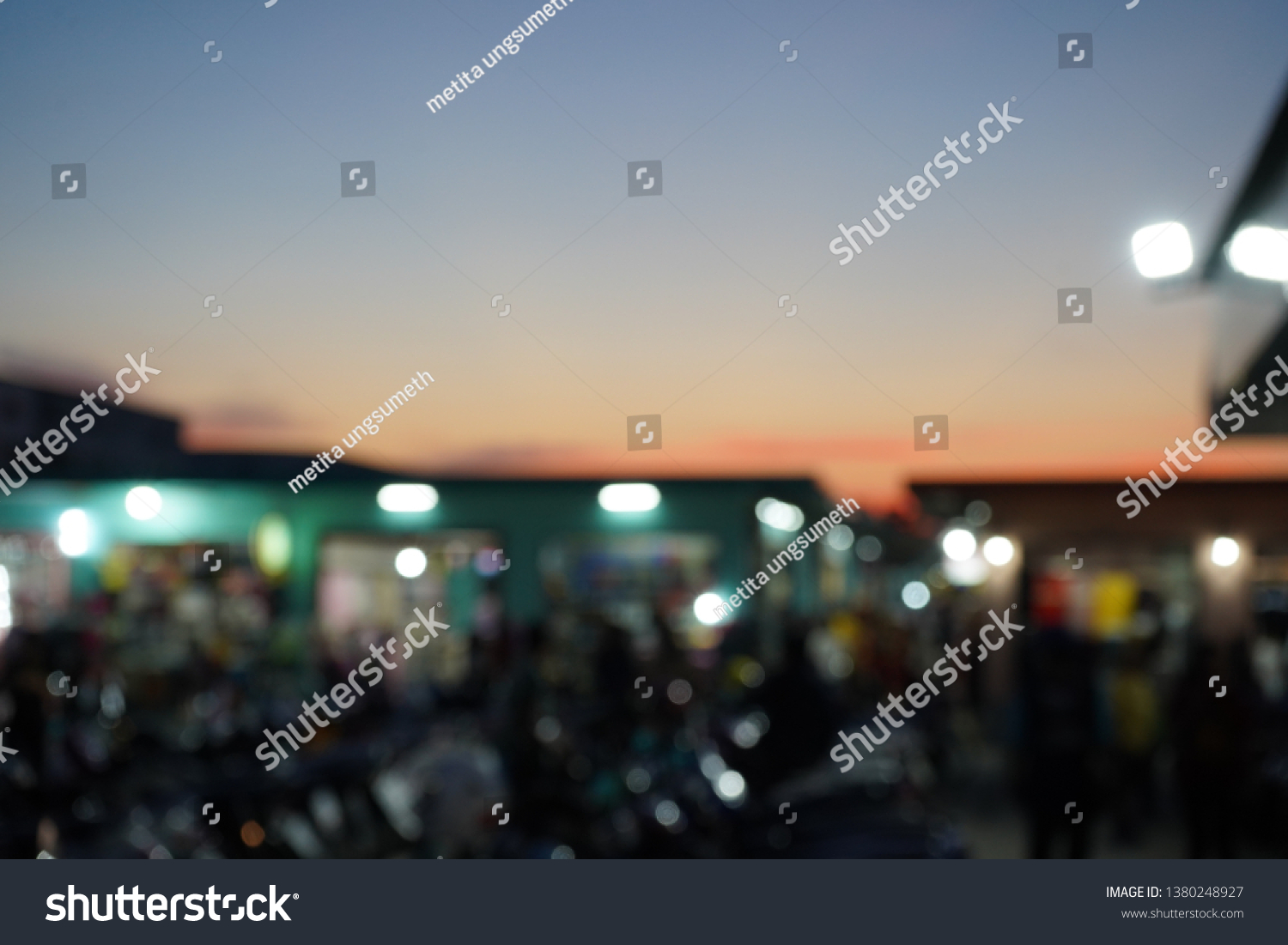 Blurry View market sunset background. #1380248927