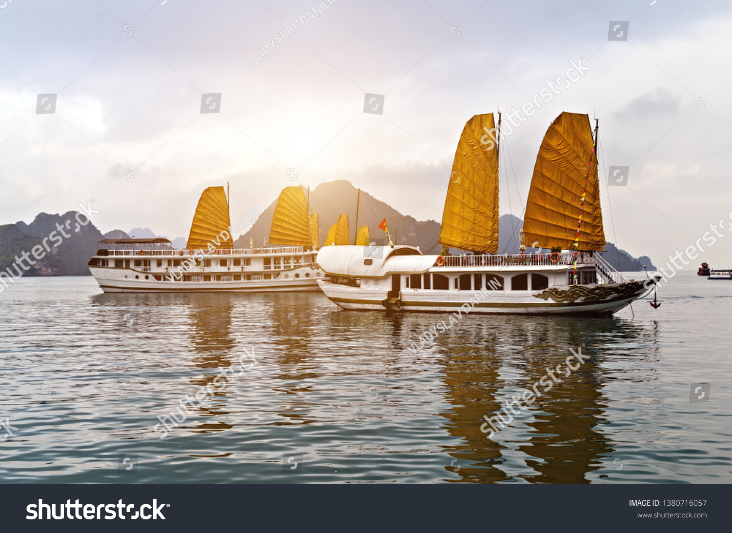 Discover Halong Bay Top Destinations Vietnam. Cruse liner golden Sails liner ship wooden junk sailing rock islands the emerald waters of Ha Long Bay. #1380716057
