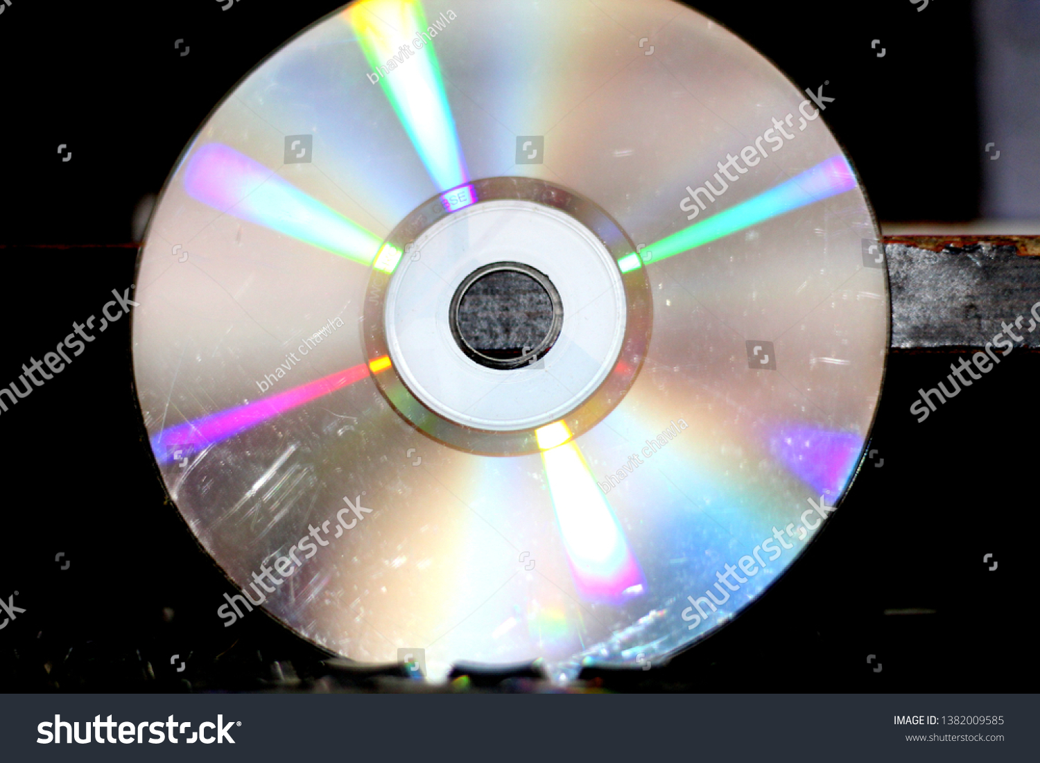 a shining disc with blurred black background #1382009585