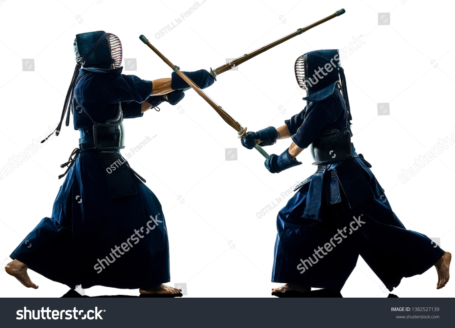 two Kendo martial arts fighters combat fighting in silhouette isolated on white bacground #1382527139