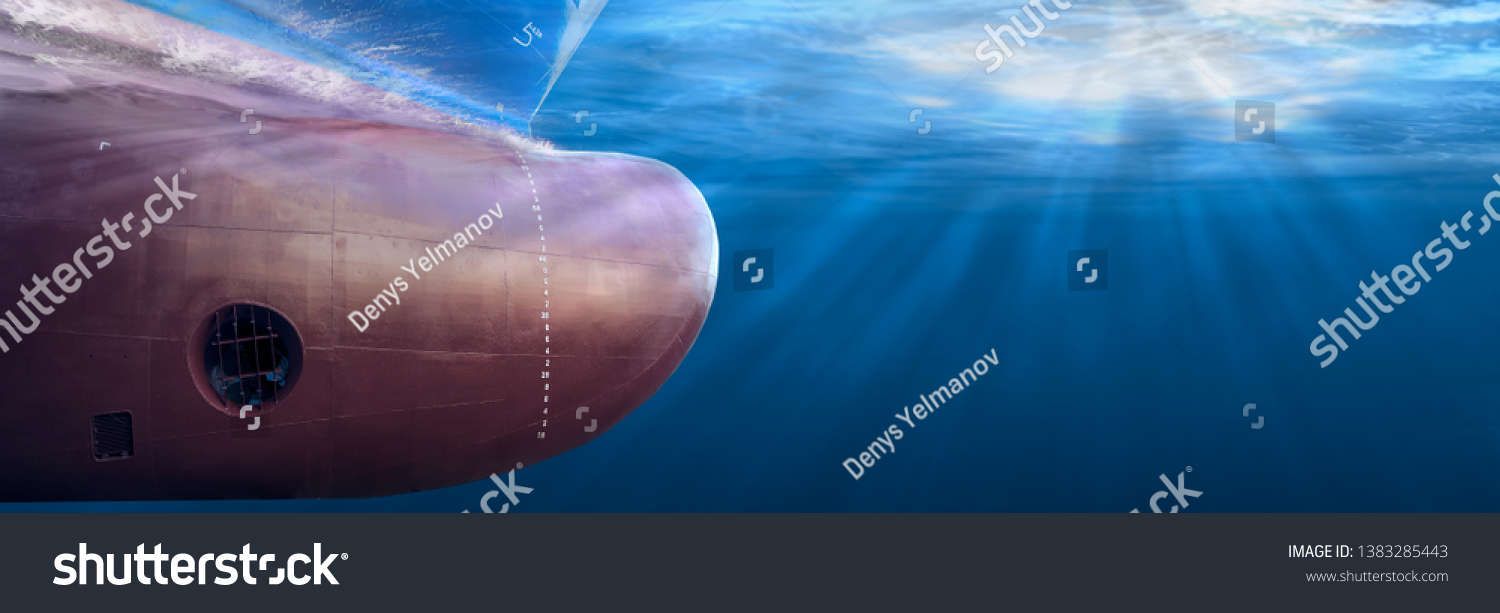 Big cargo ship sailing in the sea to Shipping container terminal. Close up image detail ships bow, underwater view. Shipping business and underwater survey concept. Hull maintenance and inspection. #1383285443