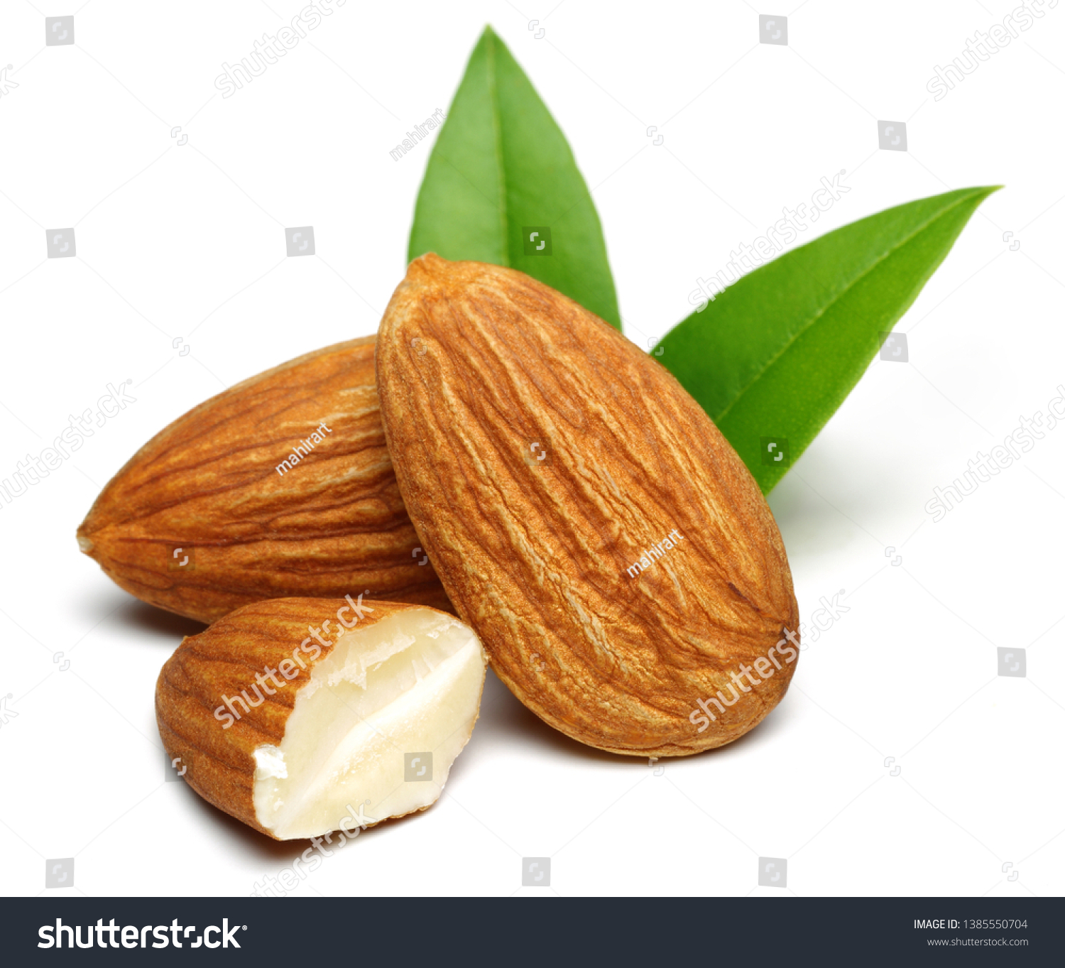 Group of almonds with leaves isolated on white background #1385550704