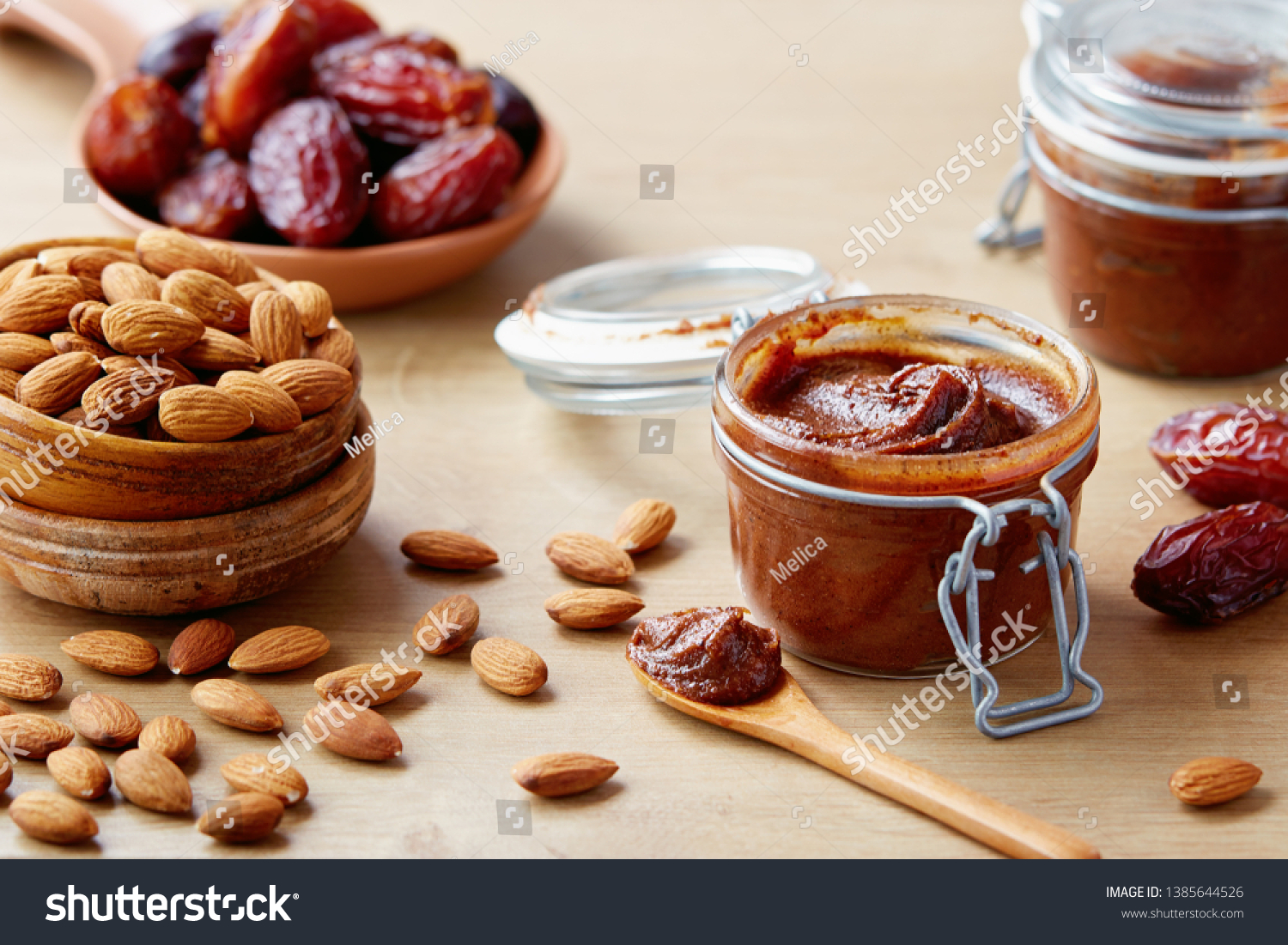 Vegan date spread with almonds (sugar-free). Jar of homemade vegan date spread. #1385644526