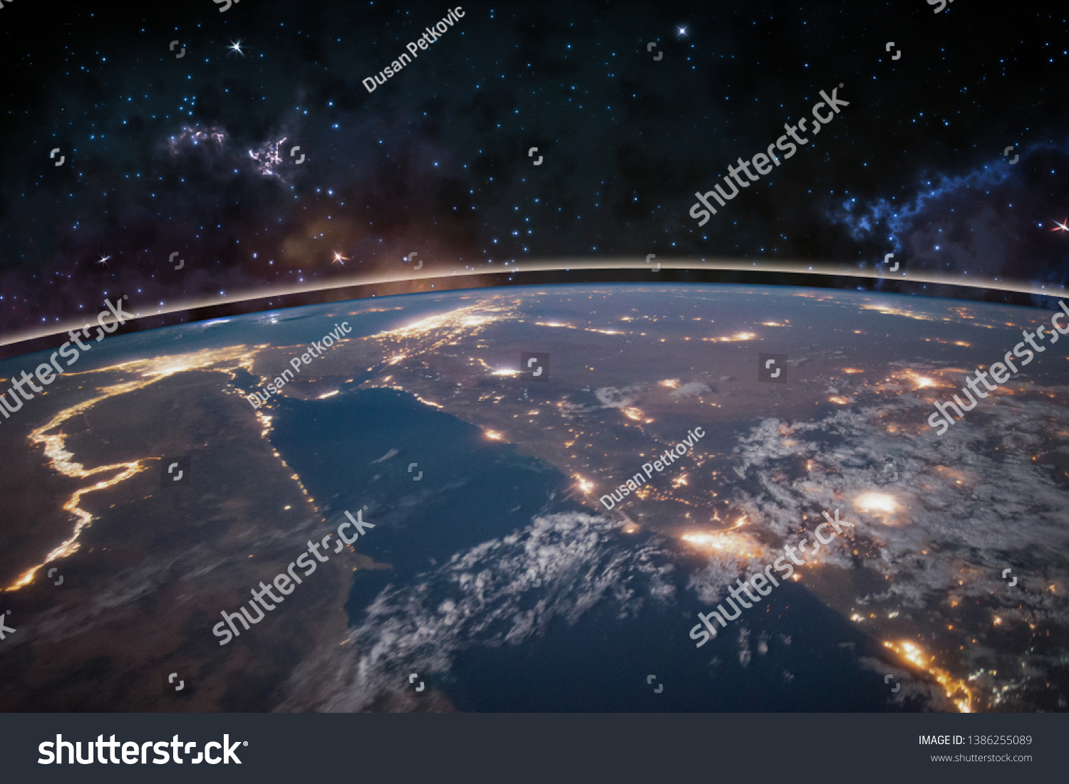 Picture of Earth in space, stars all around, night sky. Elements of this image furnished by NASA. #1386255089