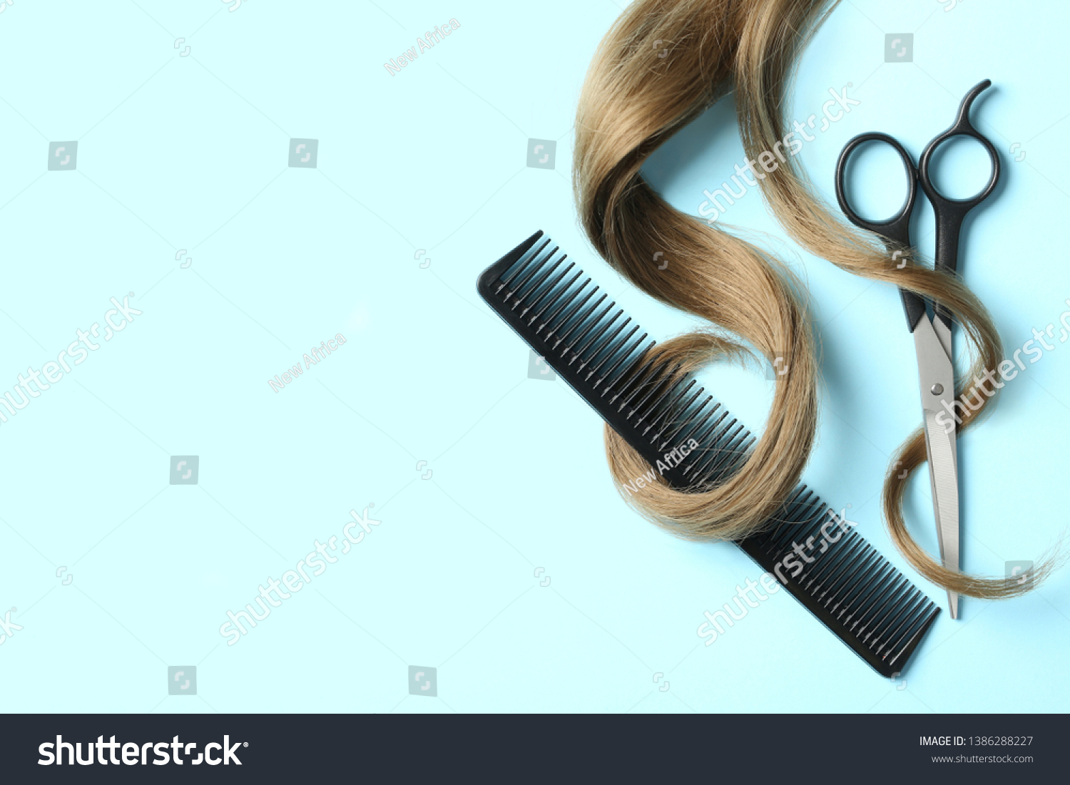 Flat lay composition with light brown hair, comb, scissors and space for text on color background. Hairdresser service #1386288227