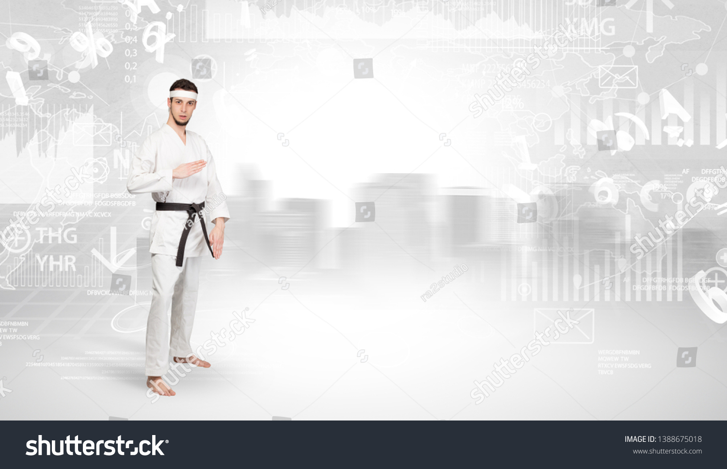 Young karate trainer doing karate tricks on the top of a metropolitan city #1388675018