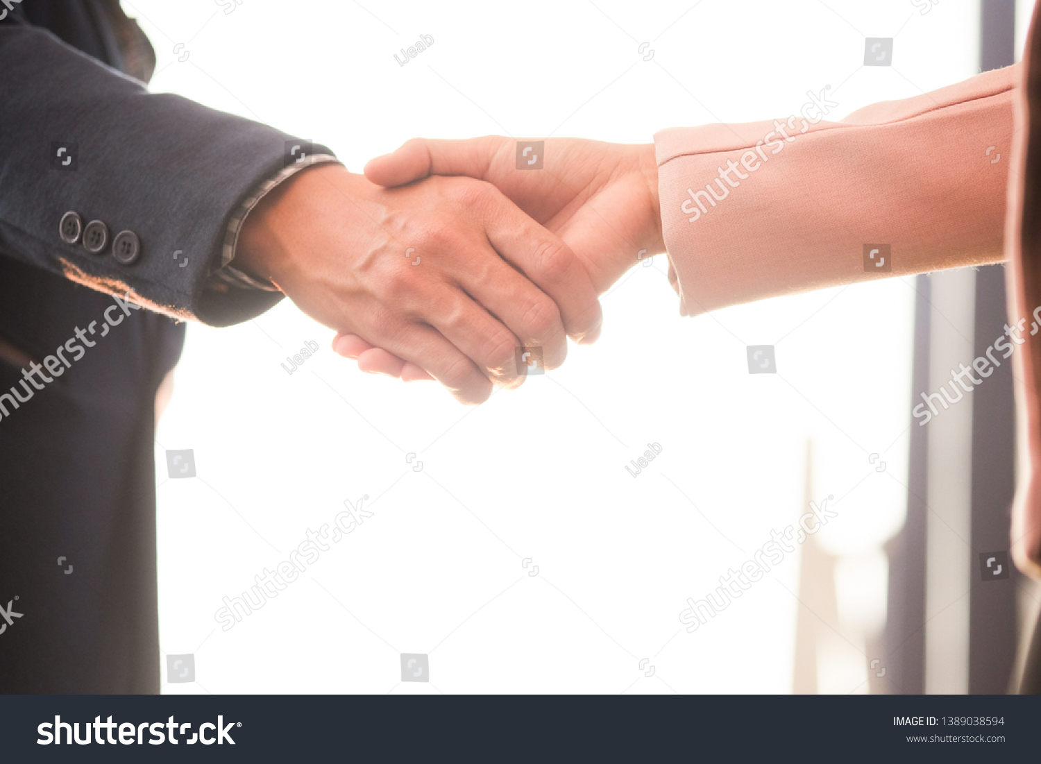 Businessmans handshake. Successful businessmen handshaking after good deal. Business partnership meeting concept.  #1389038594