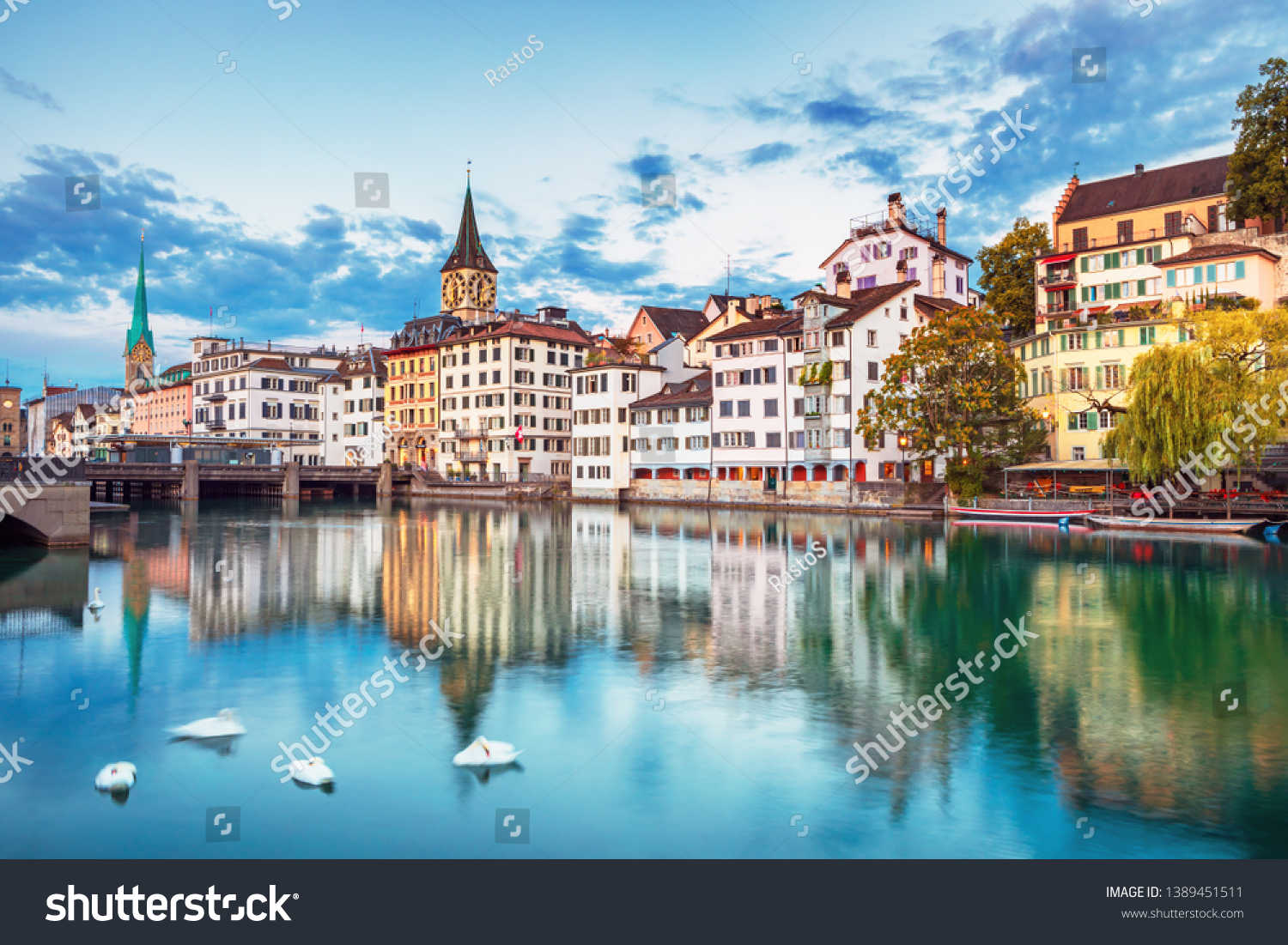 Scenic view of historic Zurich city center with famous Fraumunster and Grossmunster Churches and river Limmat at Lake Zurich, Canton of Zurich, Switzerland #1389451511