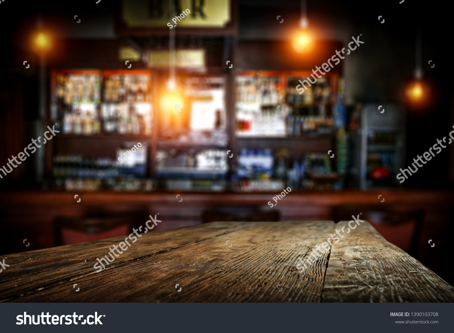 Desk of free space for your decoration and blurred background of bar.  #1390103708