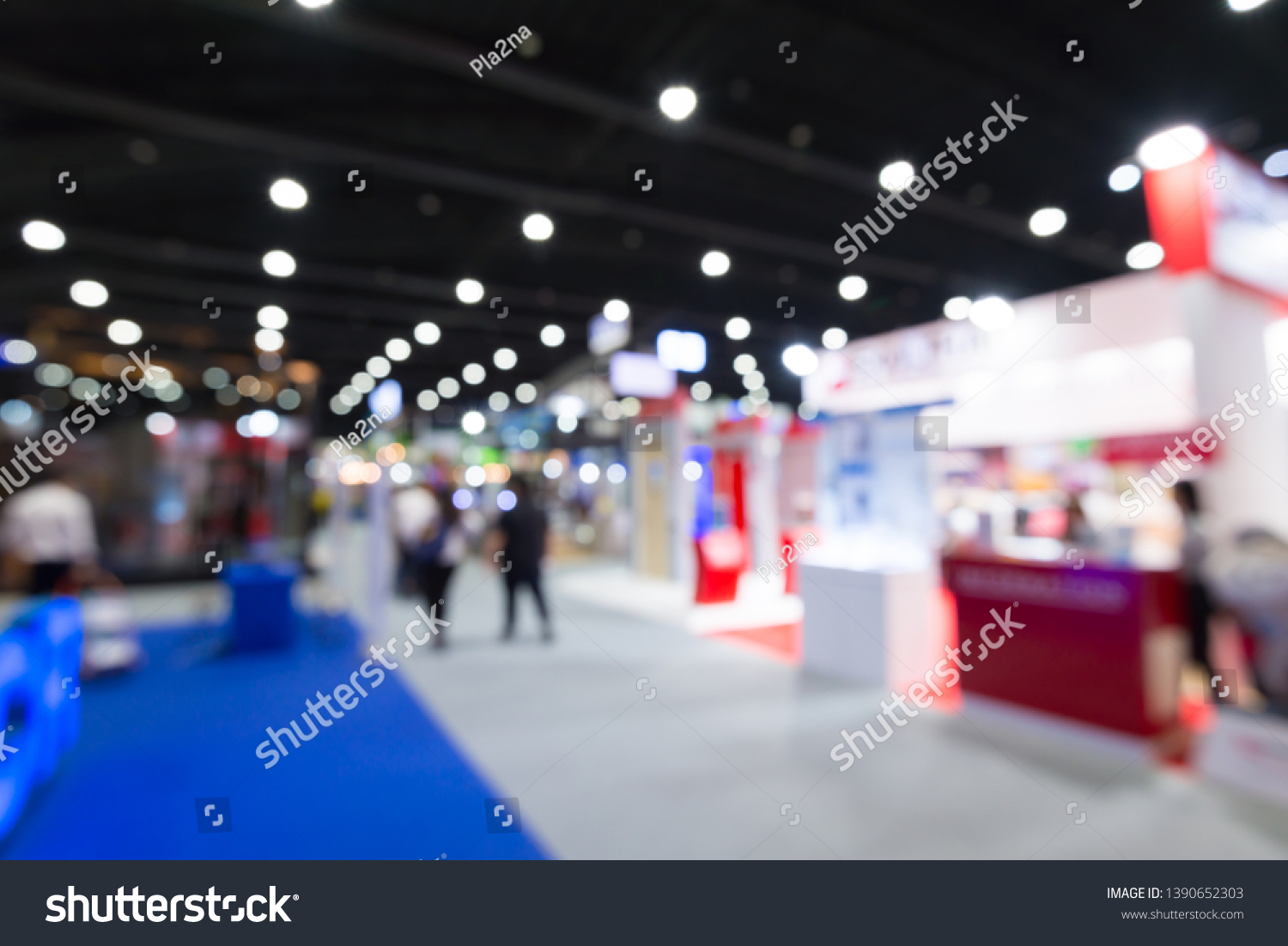 Abstract blur people in exhibition hall event trade show expo background. Large international exhibition, convention center, MICE industry business concept #1390652303