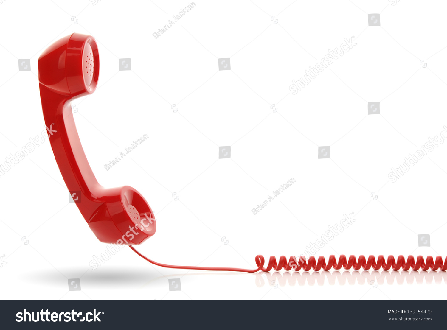 Red old fashioned telephone receiver isolated on a white #139154429