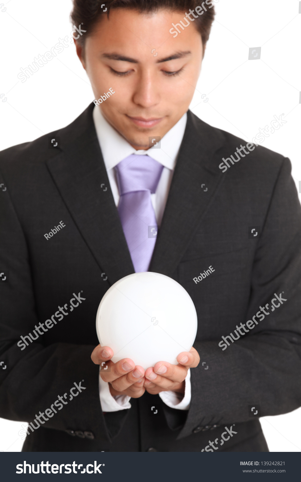 Businessman with a glass ball, looking in to the future. White background. #139242821