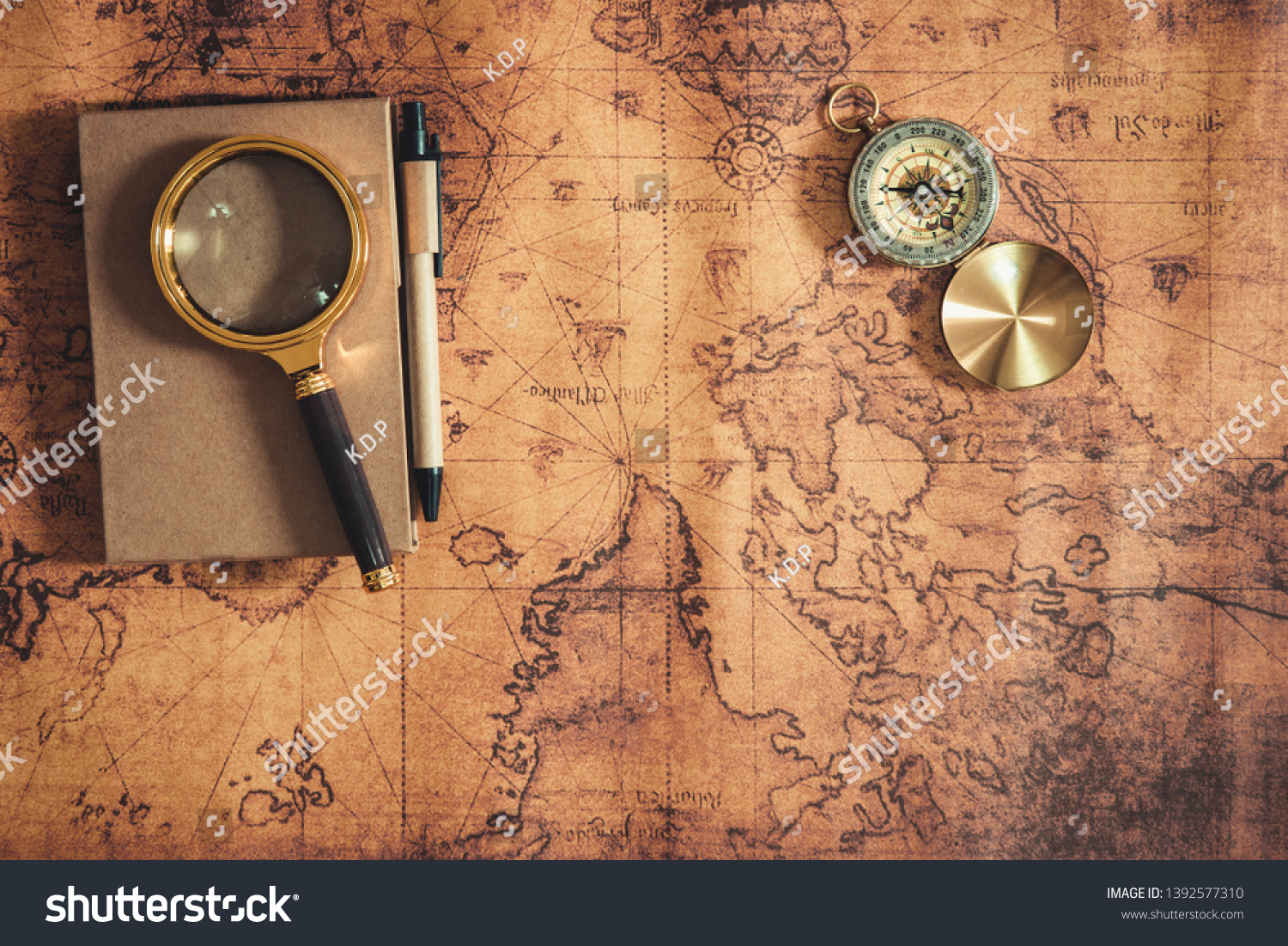 Navigation Travel Explore Journey and Destination Vacation Planning ,Exploration The World for Holiday Trip Concept. Layout of Notebook, Magnifying Glass and Navigator Compass on Global Map Background #1392577310