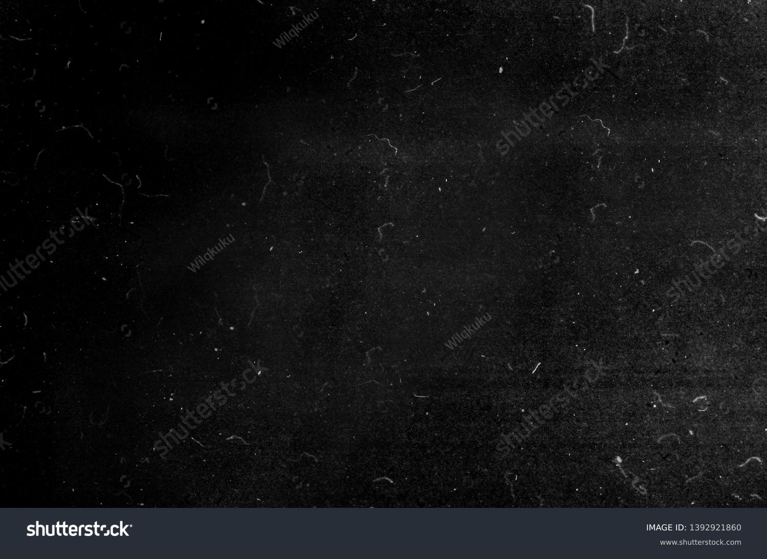Black grunge scratched background, old film effect, dusty scary texture #1392921860