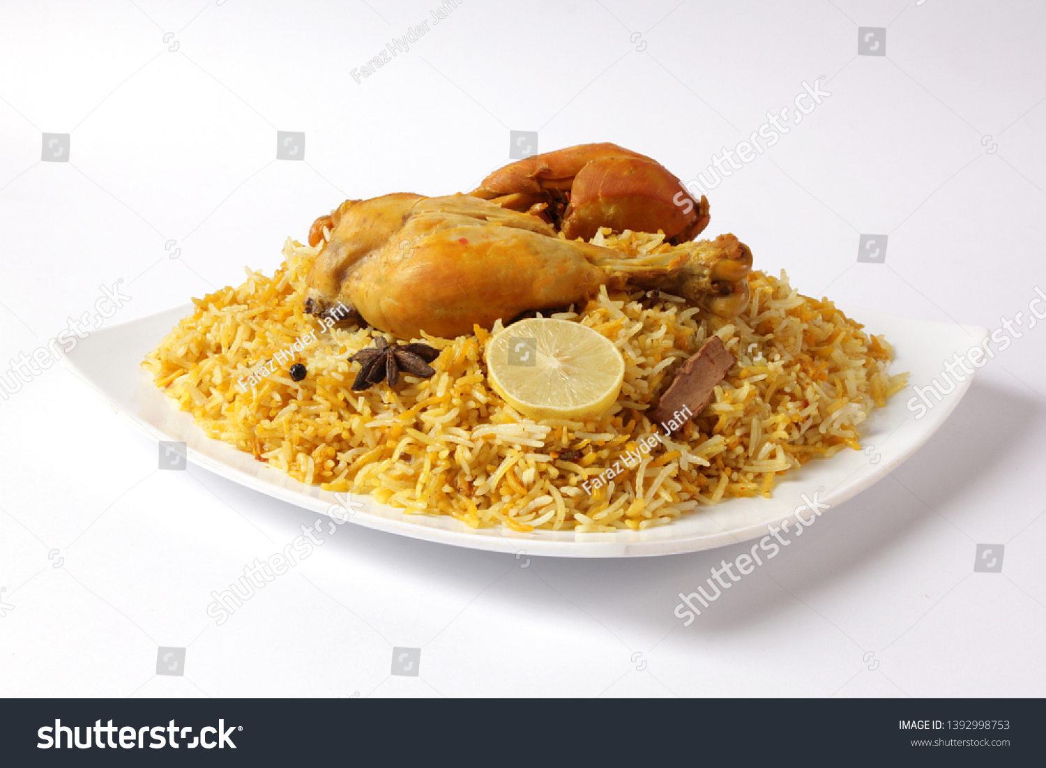 Isolated delicious spicy chicken biryani in white bowl on white background, Indian or Pakistani ramzan food. Beautiful view of traditional spicy indian food, Iftar meal, Ramadan dinner. #1392998753