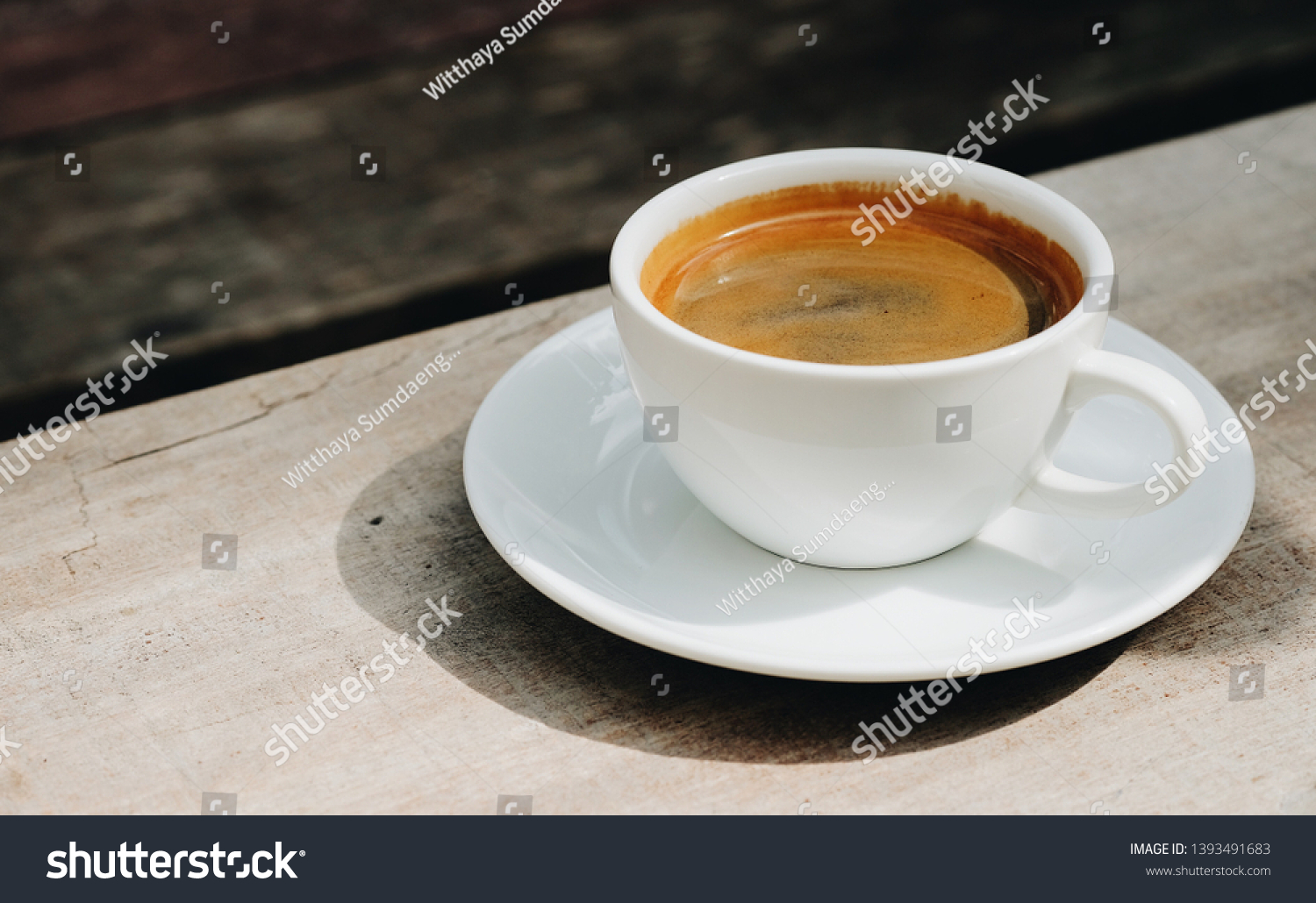 Cup of americano coffee on wooden table #1393491683