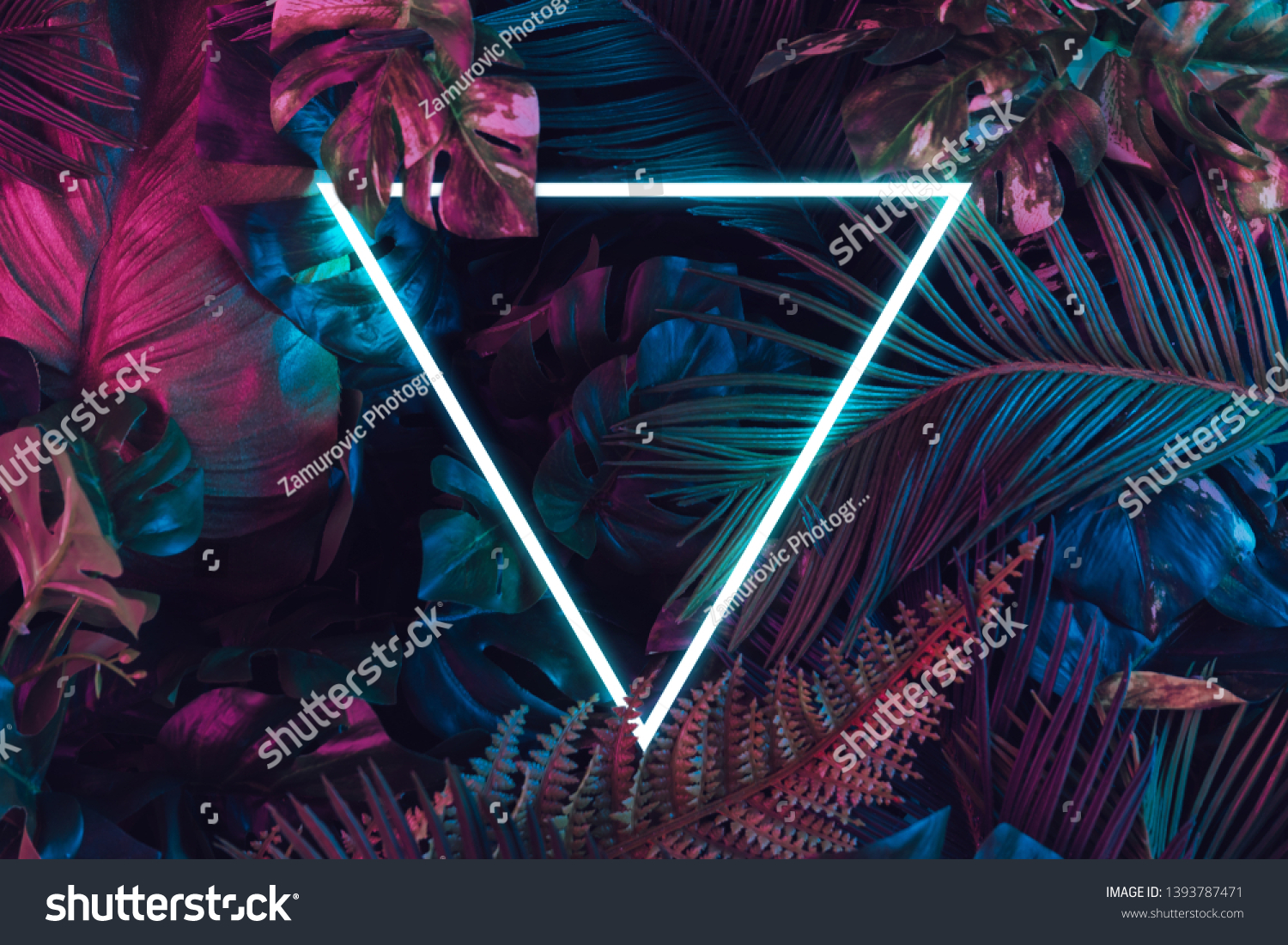 Creative fluorescent color layout made of tropical leaves. Flat lay neon colors. Nature concept. #1393787471