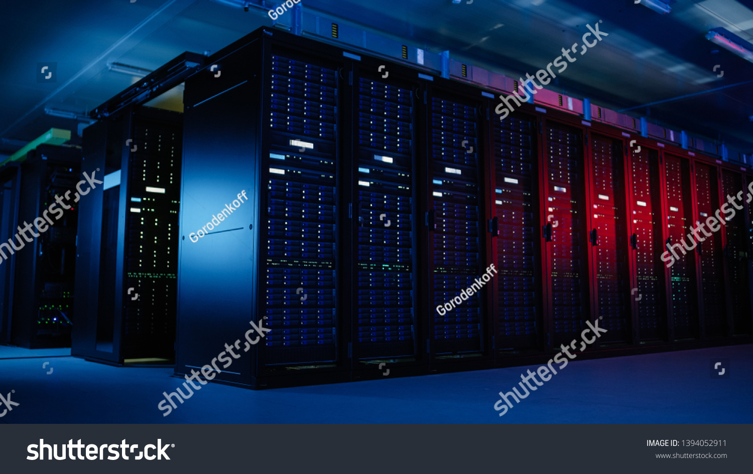 Shot of Data Center With Multiple Rows of Fully Operational Server Racks. Modern Telecommunications, Artificial Intelligence, Supercomputer Technology Concept. Shot in Dark with Neon Blue, Pink Lights #1394052911