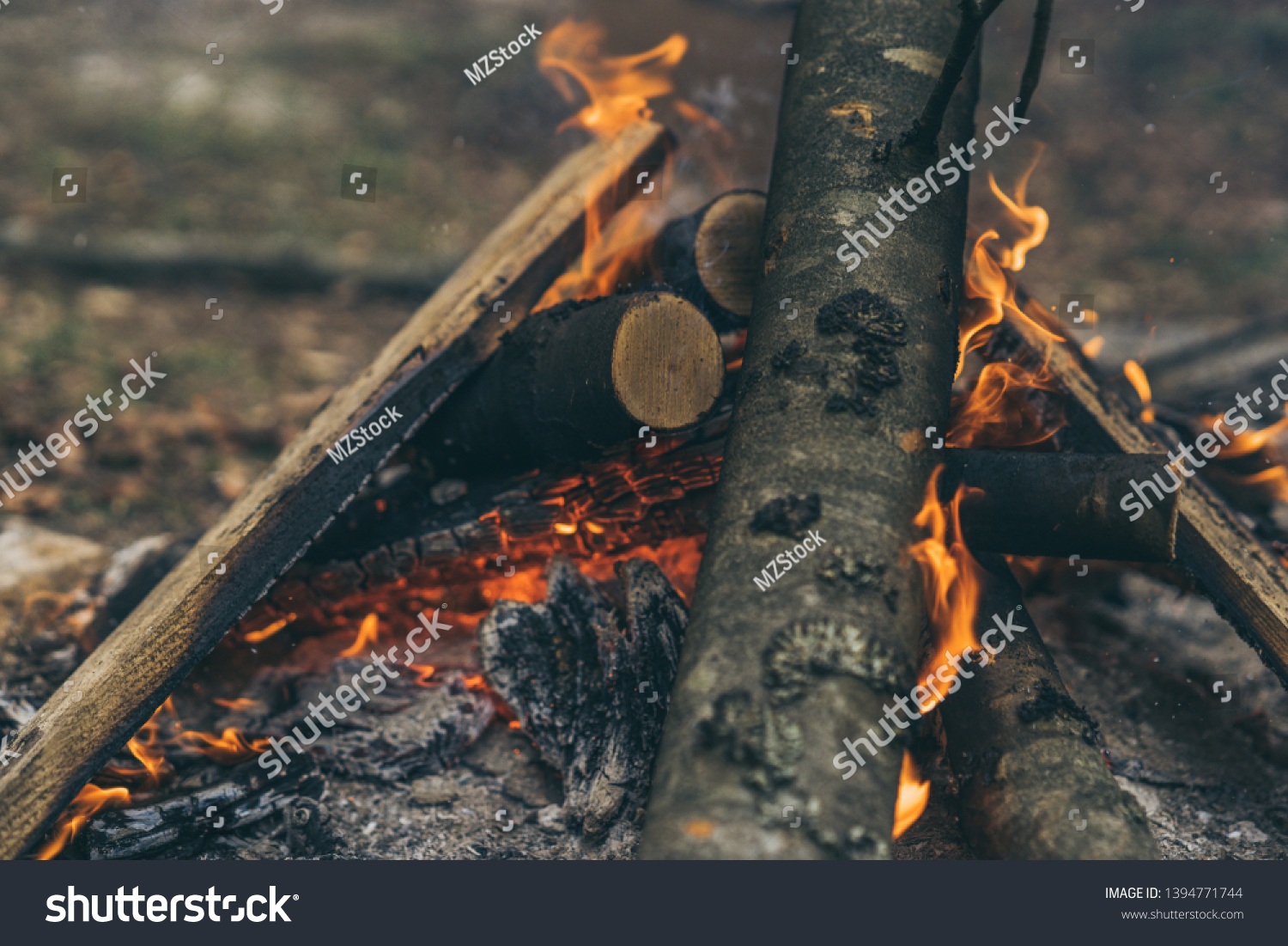 Closeup of blazing campfire coals #1394771744