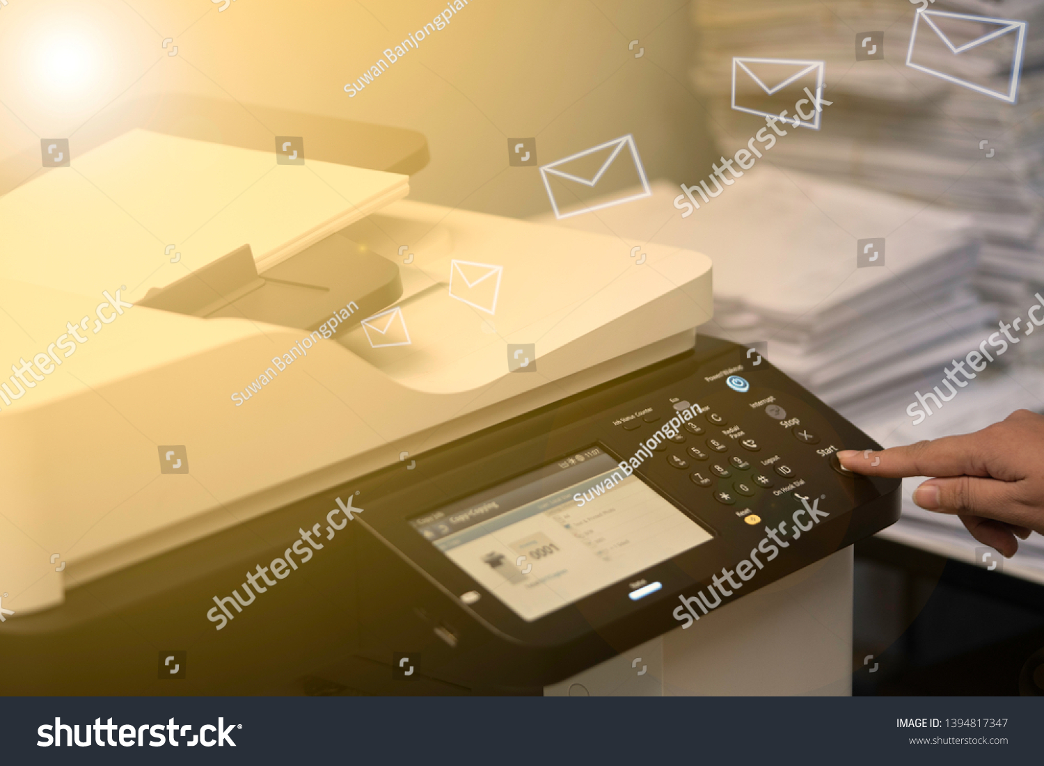 Multifunction machine scanning documents and sending to email. #1394817347