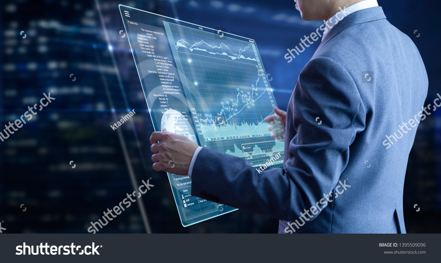 Businessman holding a modern tablet touch screen analysing on investment risk managment and return on investment analysis #1395509096