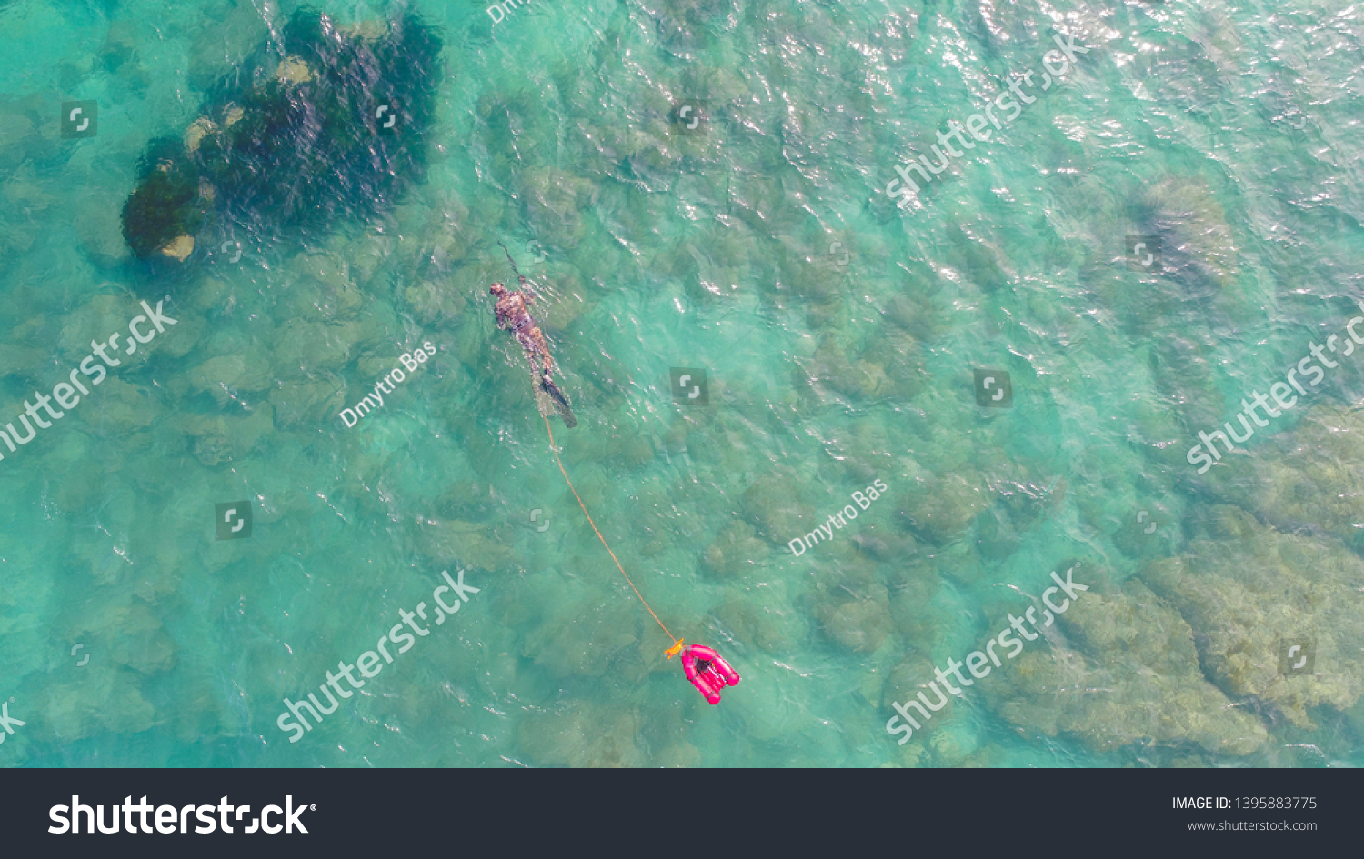air view of spearfishing in sea with small rib  #1395883775