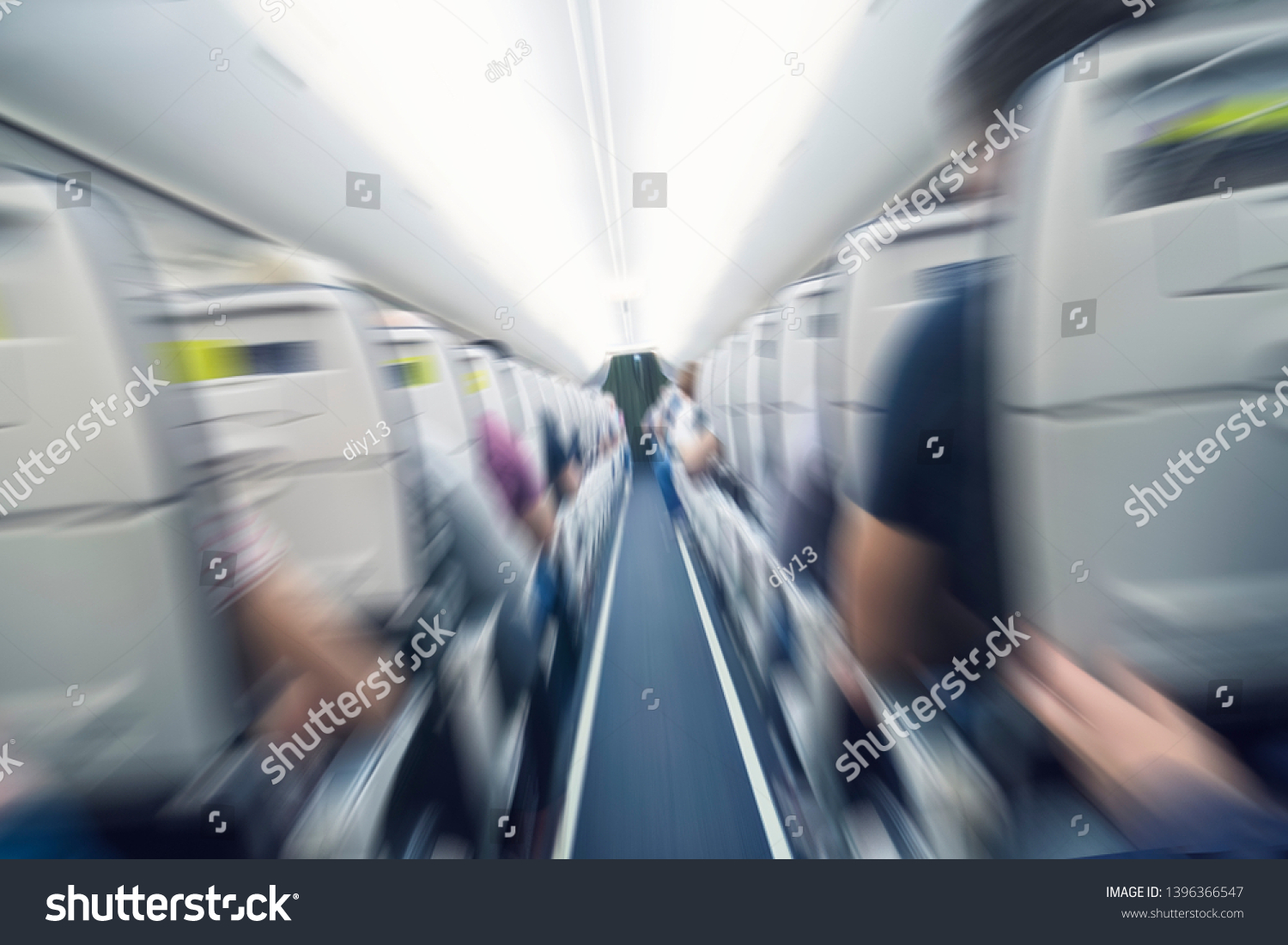 aerophobias concept. plane shakes during turbulence flying air hole. Blur image commercial plane moving fast downwards. Fear of flying. collapse slump, depression, downfall, debacle, subsidence. dive #1396366547