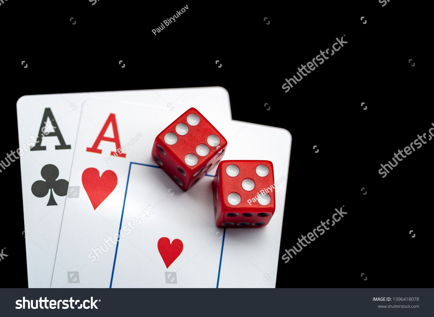 Close-up - Two aces, playing cards and red gaming dices on black table. Casino, gambling game chance concept #1396418078