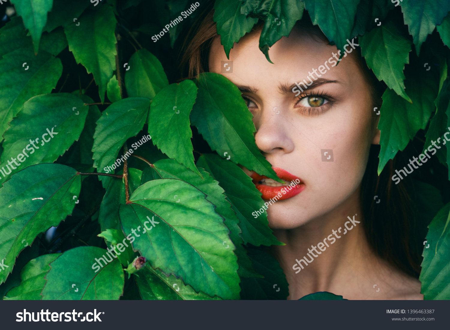 beautiful woman with make-up on face exotica green shrub nature model cosmetology #1396463387