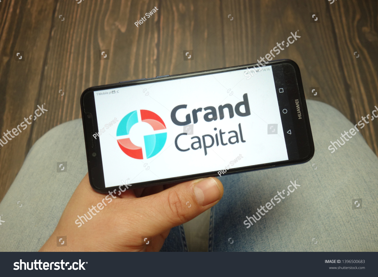 KONSKIE, POLAND - 05 MAY, 2019: Grand Capital company logo displayed on Huawei smartphone #1396500683