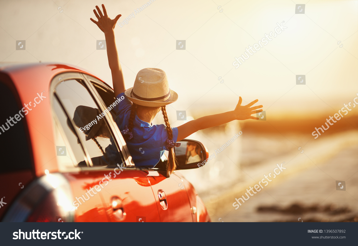 happy child girl goes to summer travel trip in the car
 #1396507892