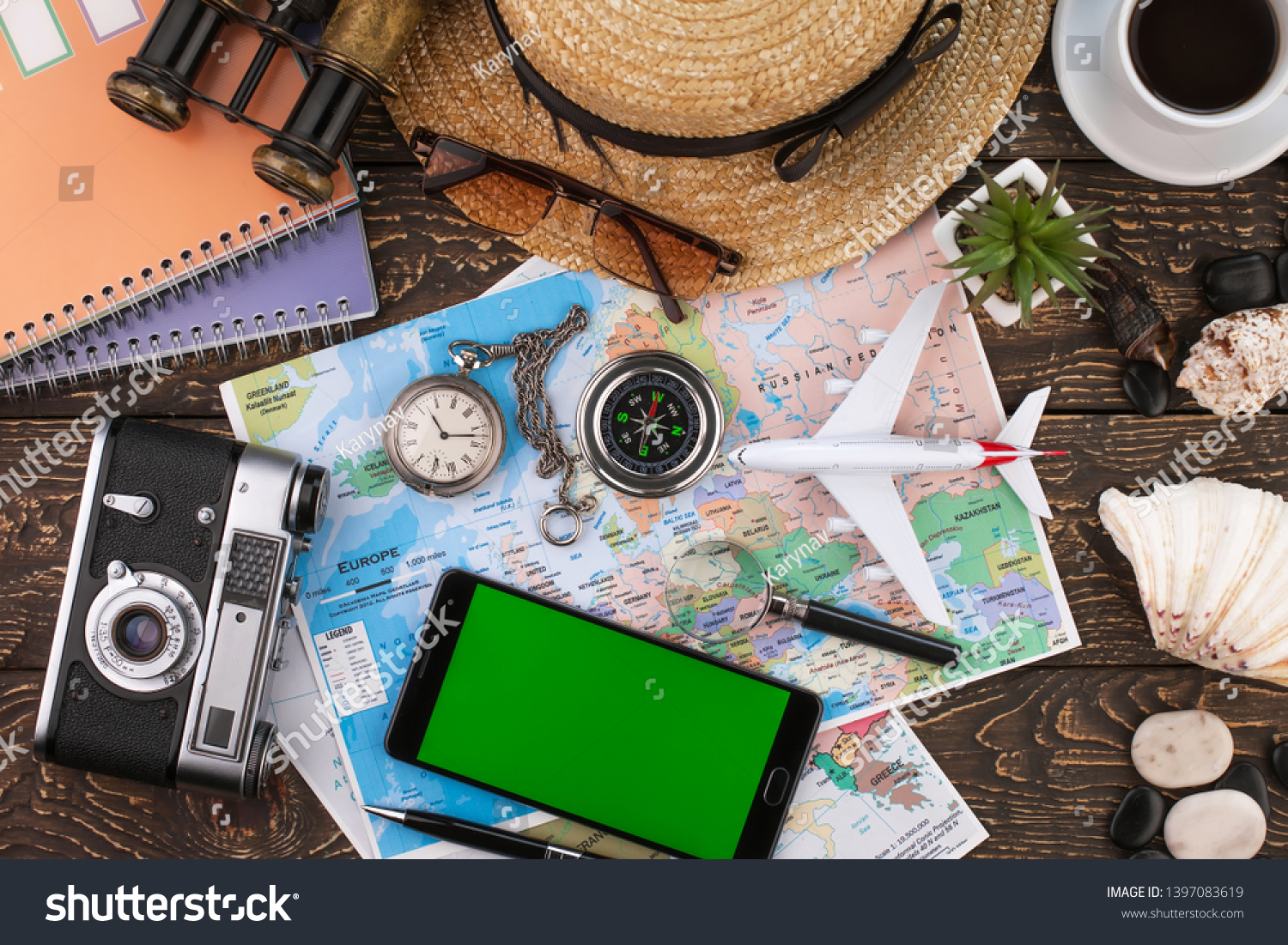 items and accessories for the traveler on the old background on the table #1397083619