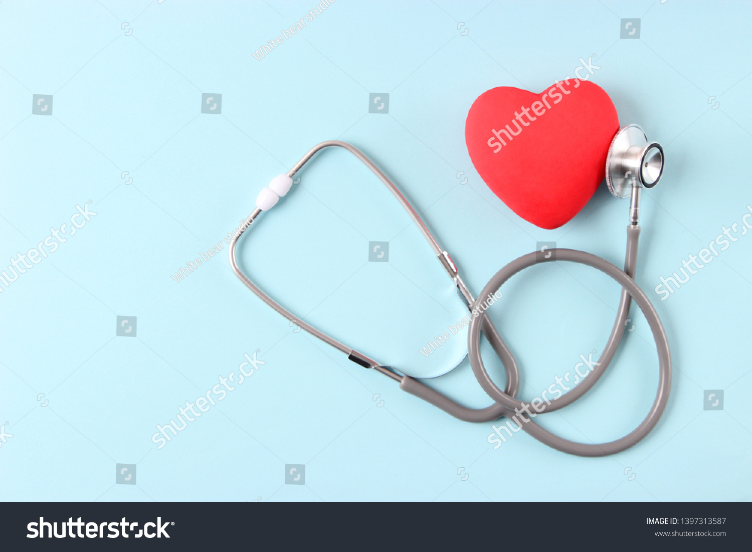 Stethoscope and heart on wooden color background. Health, medicine
 #1397313587