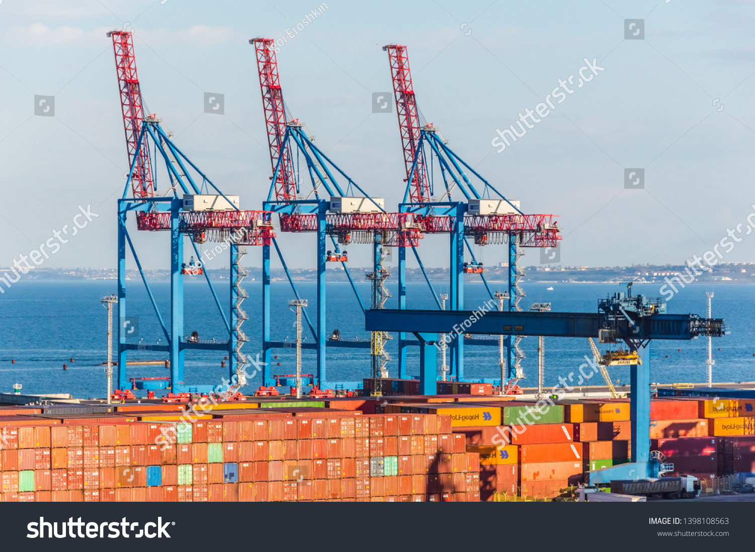 Sea Trade Port, Odessa City, Ukraine, May 2019. Container terminal. Cranes, cargo ships. Horizon.   #1398108563