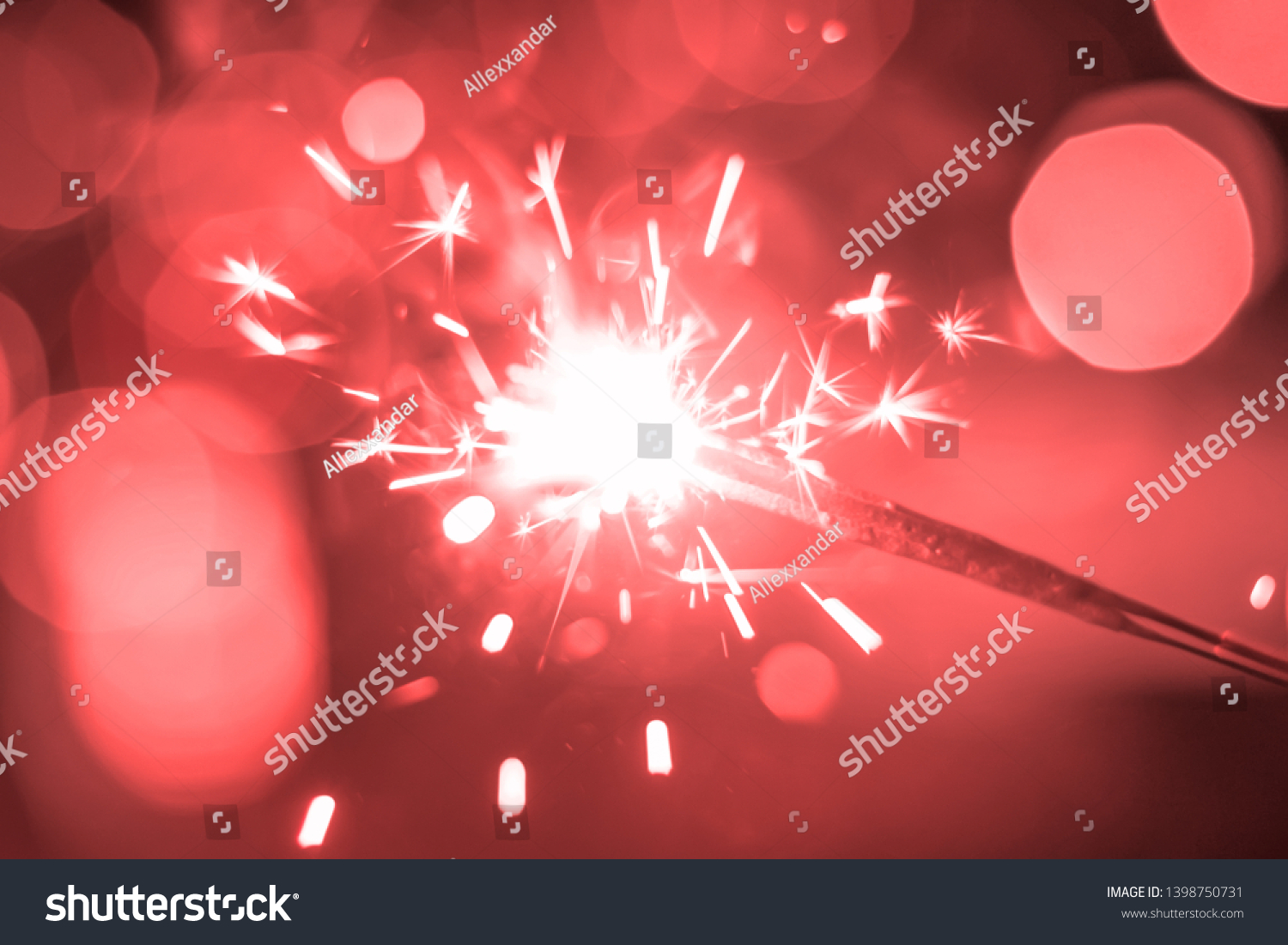 Sparkler Bokeh Colorful sparkler. Night background with a sparkler.  #1398750731