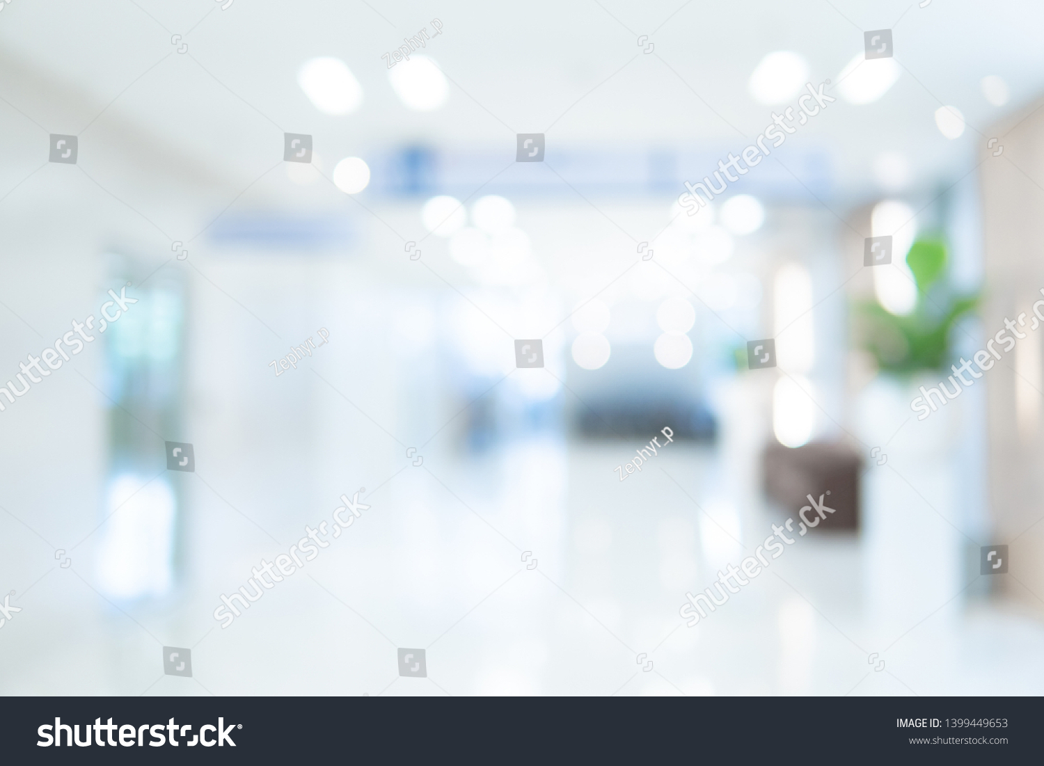Abstract blur luxury hospital corridor. Blur clinic interior background with defocused effect. Healthcare and medical concept #1399449653